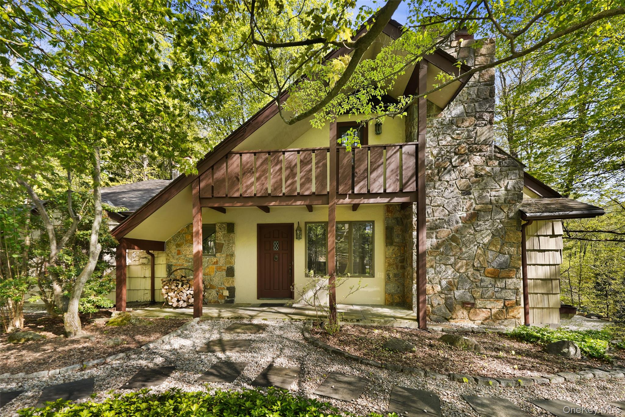 THE PERFECT RETREAT. Overlooking a pristine pond and stream, charming Country House with elements of a European chalet. Striking interior spaces with vaulted and beamed ceilings and walls of glass to capture light and views. Dramatic Living Room with vaulted ceiling and floor-to-ceiling stone fireplace. Country Kitchen with Dining Area and fireplace. Three sun-filled Bedrooms. Two Baths. Incredible wrap-around deck overlooking the pond and waterfall. Three serene acres with spring-time blooms and Mountain Laurel. Conveniently located and just minutes from Bedford Village, Scotts Corners and Stamford Connecticut. First time offered!