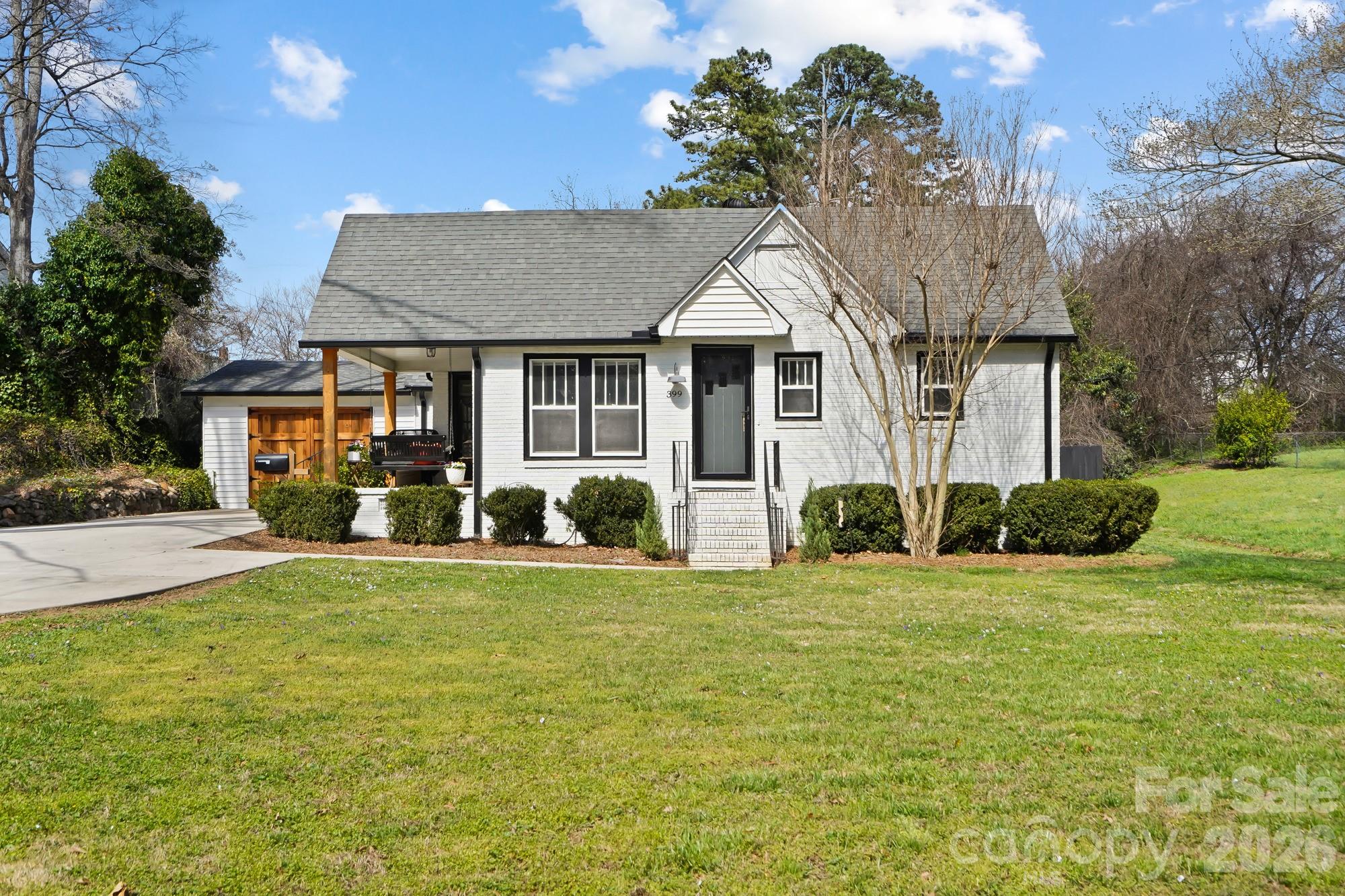 GORGEOUS CHARM AND CHARACTER of a 1930s home wrapped up with MODERN UPDATES and touches! MOVE-IN READY 3 bed/ 2 bath full-brick ranch with garage. This lovely home boasts beautiful '30s features such as restored original hardwoods, interior 5-panel doors and 15-lite glass doors, original glass doorknobs with working skeleton key locks (and yes, with the original keys!), restored beadboard ceilings, and RARE four-over-one windows. The square footage in this home has been very well utilized! A spacious and functional kitchen with all the modern trim, shaker cabinets with granite countertops, breakfast bar, and stainless appliances. A formal dining room fit for entertaining, complete with French doors. The primary suite is one to fall in love with! Plenty of space in this bedroom, stunning accent wall, private bathroom, and a large walk-in closet full of light. Added bonus: a rocking-chair porch right off the bedroom. Perfect to enjoy a cup of coffee in the morning or a good book. In this home you'll also find two more bedrooms and a 2nd bathroom. Step outside to a brand-new multi-level Trex deck and Gazebo. A delightful space to relax and wind down or gather and enjoy company. Fully fenced backyard includes a storage building. Don't miss the attached garage on this house! It's currently being used by the owners as a home gym, finished with custom barn doors that can be opened to let in fresh air. But could easily be used again as a regular oversized one-car garage. Key feature: the HEATED/COOLED FLEX SPACE behind the garage. Perfect for a craft room or art studio, home office, small workout room, or simply additional conditioned storage space.Some other renovations to note-- electrical and all plumbing updated throughout, sealed crawlspace, spray foam insulation in attic.Conveniently located in the heart of Kannapolis, just a short 0.7 miles from the newly revitalized Downtown Social District, Atrium Health Ballpark, the Gem Theatre, Village Park, and so many shopping and dining options. A prime location! ***Sellers offering Diamond Level HWA HOME WARRANTY.