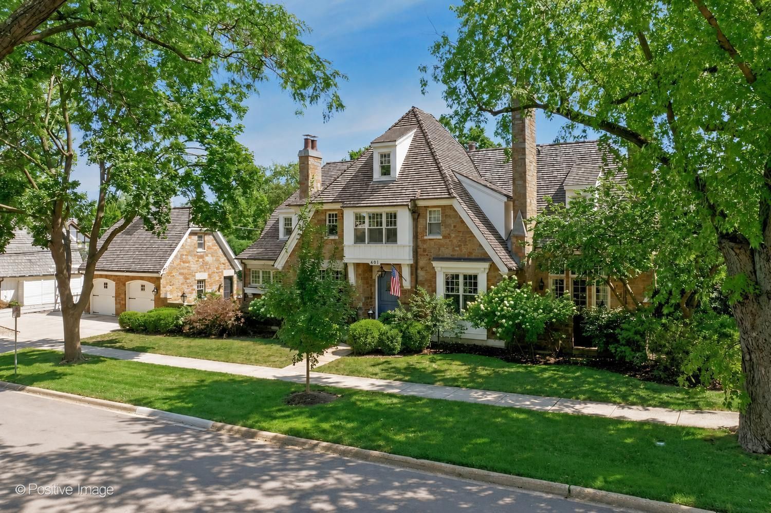 The In-Town Hinsdale Location Everyone Wants. Just steps from the train, downtown dining, shopping, and everything that makes Hinsdale living so special, this much admired three-story all stone residence offers the rare combination of a truly walkable location and an exceptional luxury home. Timeless architecture, outstanding craftsmanship, and an inviting open floor plan set the tone. Designer lighting, impressive millwork, and thoughtful architectural details throughout. A dramatic two-story family room creates warm, elegant spaces for everyday living and entertaining. The chef's kitchen is equally impressive, featuring a built-in breakfast banquette that creates the perfect spot for casual meals and everyday gathering. The oversized dining room, complete with its own fireplace, provides an elegant yet inviting setting for memorable dinners. The desirable first-floor primary suite features a fireplace, luxurious private bath, and serene views of the secluded courtyard and stone patio. A stylish private office, powder room, mudroom and laundry complete the first floor. The second floor offers four spacious bedrooms and a convenient secondary laundry room, while the third floor features an additional private bedroom suite - ideal for guests, an au pair, or a quiet home office. The spectacular lower level is designed for entertaining with a wet bar, expansive recreation room, additional bedroom/exercise room, and full bath. Outdoors, enjoy a private retreat complete with a stone fireplace, built-in grill, and generous patio. The 2-car garage has an additional covered parking area for a 3rd vehicle. This is a truly special home in an even more exceptional location, offering the best of in-town Hinsdale right outside your door.
