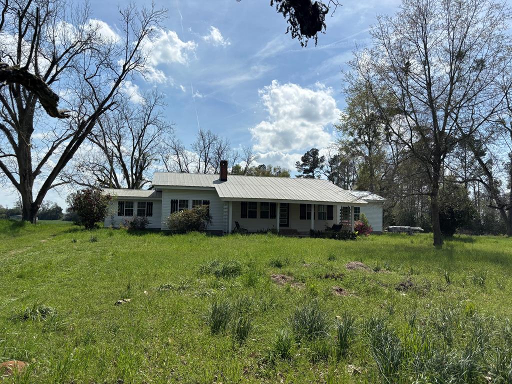 Beautifully restored home situated on 21 scenic acres, offering the perfect blend of privacy, charm, and opportunity. The home features 1,973 sq ft according to the tax card, with an additional master suite currently under construction that will soon add even more living space and comfort. The master suite is a work in progress and expected to be completed within approximately two months. Inside, the home has been completely restored with thoughtful craftsmanship throughout. You'll love the hand-cut hardwood floors that add warmth and character to the living spaces. The kitchen is full of farmhouse charm, featuring butcher block countertops, a classic subway tile backsplash, and a beautiful farm sink, with an additional farm sink located in the mud room for added functionality. This property offers 21 acres of versatile land, with approximately 8 acres currently rented for agricultural use, providing potential income or the opportunity to continue farming. The remaining acreage is partly wooded, creating a peaceful setting with plenty of space to explore and enjoy nature. There is also an ideal location on the property to build a pond, making it easy to create your own private retreat. With 3 bedrooms, 3 bathrooms, restored charm, and room to grow, this property offers a rare opportunity to enjoy country living with modern updates and endless possibilities.
