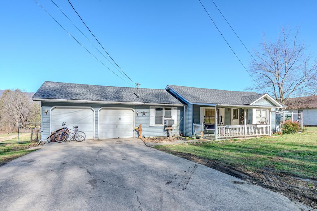 Investment Opportunity Near Downtown Andrews! This versatile property offers a rare combination of immediate rental potential and future income growth. Conveniently located close to downtown Andrews, the property includes a 3 bedroom, 1.5 bathroom primary residence plus an additional 2-bedroom, 2-bath single-wide trailer, making it ideal for investors or owner-occupants looking to offset expenses. The main home features a newer roof (approximately 2 years old), an attached 2-car garage, and a large sunroom currently used as a laundry room, providing flexible living space. Both the house and the trailer are in decent, livable condition, with some TLC needed over time—but no immediate major repairs required. The land is unrestricted with ample room to add another single-wide, offering the opportunity to increase monthly rental income even further.