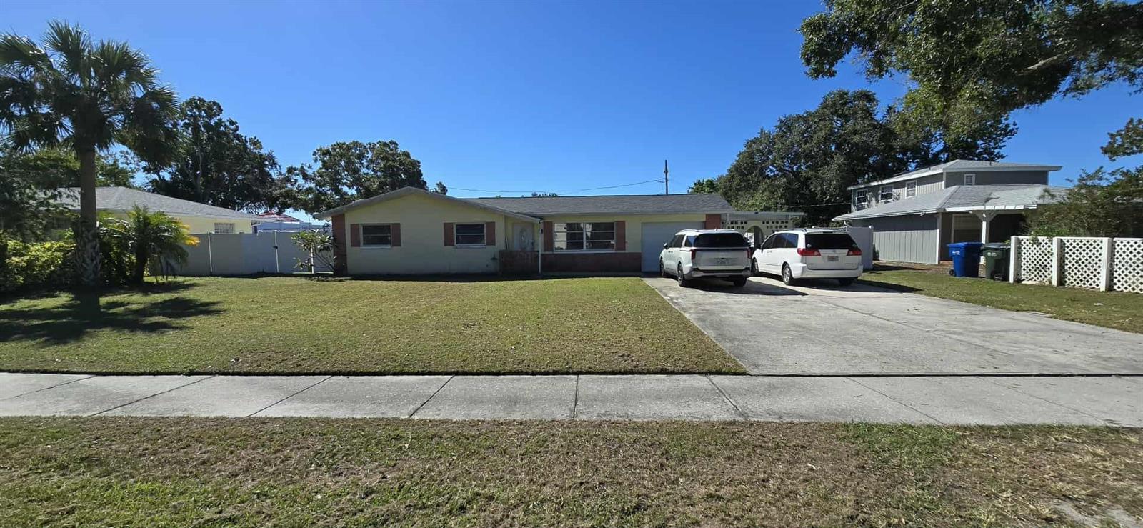 Welcome to this beautifully maintained 3-bedroom, 1-bathroom home featuring a bright bonus Florida room—perfect for relaxing or entertaining. The  spacious kitchen offers a breakfast bar, tile flooring, and abundant cabinet space for all your storage needs. Enjoy comfort throughout with ceiling fans in the kitchen and bedrooms, and step outside to the oversized patio, ideal for grilling or outdoor gatherings. The newly renovated backyard is covered with artificial turf, meaning no lawn work required! Customize the space with your own personal touches—add patio furniture, an umbrella, fire pit, or even a gazebo. There’s ample parking, with enough room for multiple vehicles, a boat, or an RV. Major updates include a new roof (2024), A/C (2018), and water heater (2016), giving you peace of mind for years to come. Conveniently located near the Clearwater Marine Aquarium, Pier 60, and a variety of shopping and dining options in downtown Clearwater.  Don’t miss this move-in-ready gem in a prime Clearwater location!