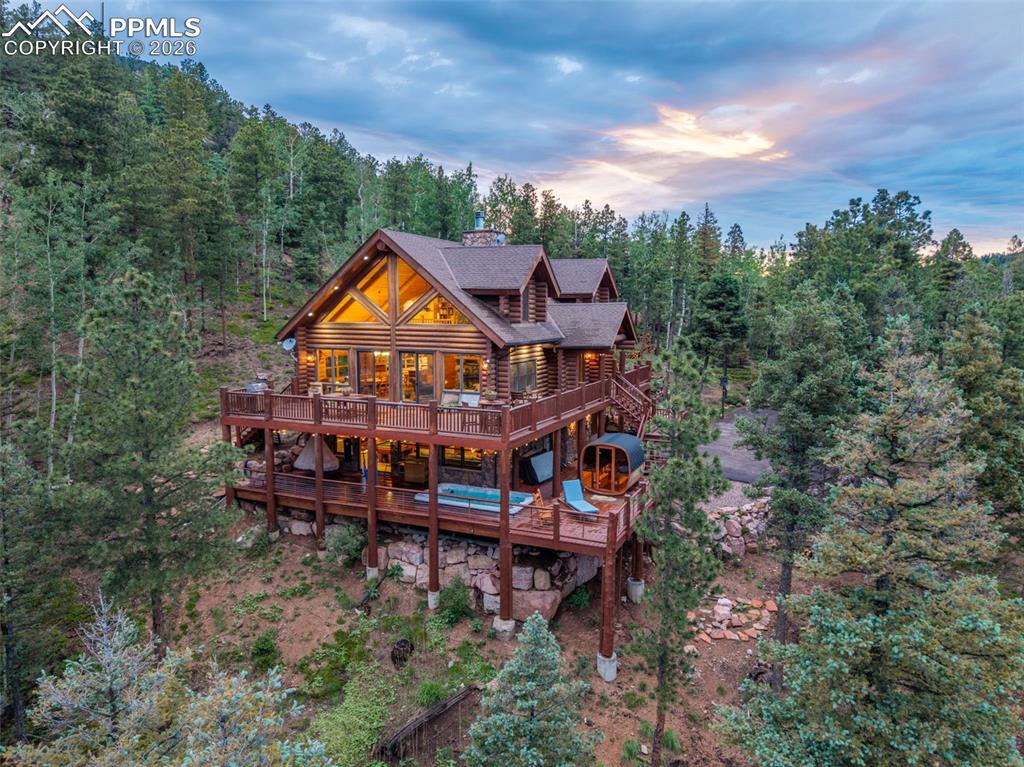 ***See the amazing Video of this home at the Virtual Tour Link!*** Discover this incredible custom log home nestled in the highly sought-after Crystal Park community in the breathtaking Colorado Rocky Mountains. Surrounded by over 2,000 acres of pristine community land and backing to tens of thousands of acres of untouched national forest, this home offers unmatched privacy and spectacular natural beauty.Step inside to soaring ceilings, a dramatic wall of windows that captures panoramic mountain views, and a warm, inviting interior. Outdoor living is just as impressive with expansive decks perfect for relaxing or entertaining. Wellness and leisure are built-in with a private lap pool/hot tub, a sauna, and serene mountain surroundings.Crystal Park is an exclusive gated community offering top-tier amenities, including a clubhouse, heated swimming pool, tennis courts, a private fishing lake, miles of scenic hiking trails, and a private entrance for added peace of mind.Don’t miss this rare opportunity—homes like this don’t last long. Call today to schedule your private showing before it’s gone!