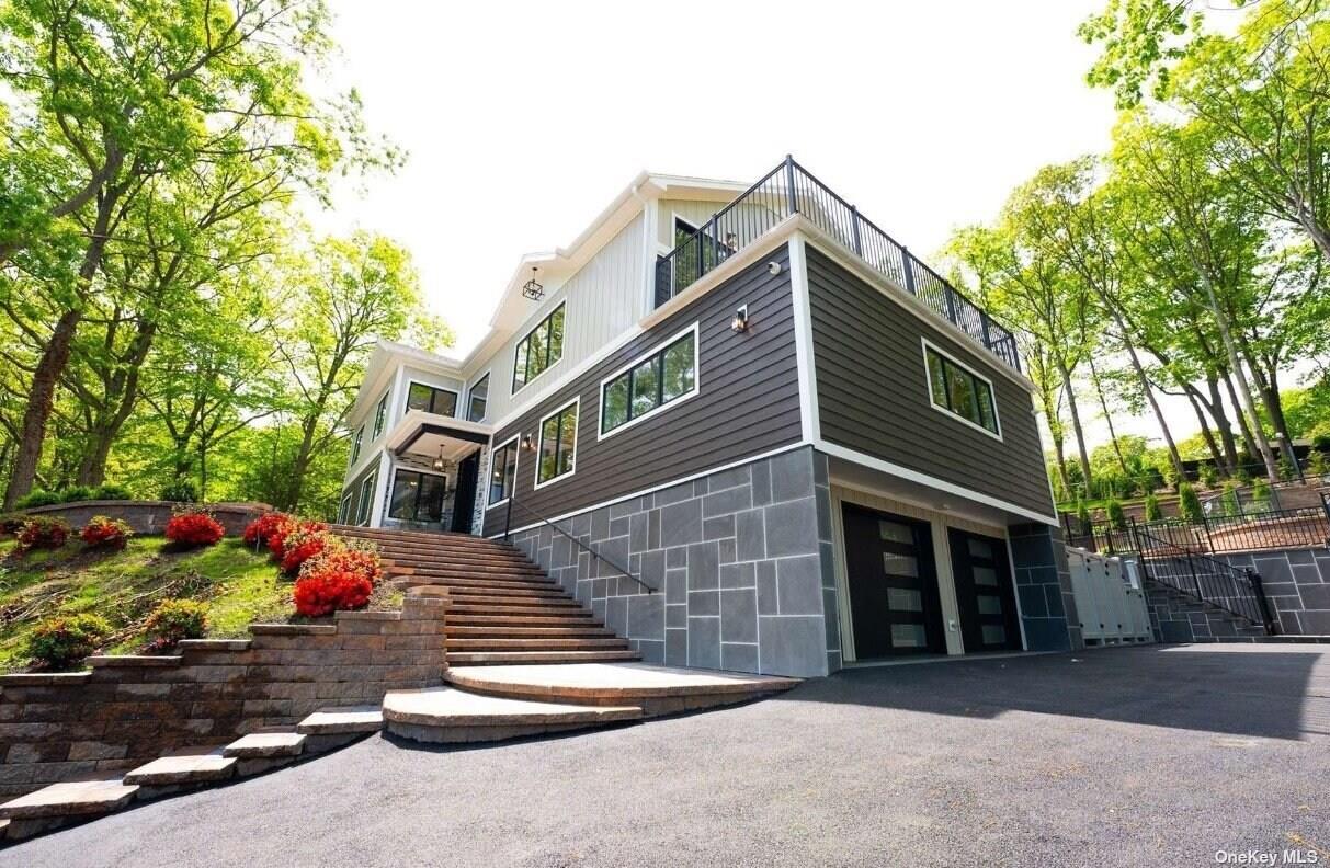 Elegance and Custom Beauty! Presenting this stunning 1yr old new construction, high-efficiency Smart Home featuring a 35-year architectural roof. With Pella windows, an energy-efficient 15-ton Mitsubishi hyper heating/cooling system, and a radiant heated driveway, this home sets a new standard in modern living. Step inside to discover Brazilian white oak hardwood floors with walnut border throughout, complemented by a kitchen adorned with Fisher & Paykel appliances, including dual dishwashers, a double wall oven, and an induction stove. The marble sushi bar in the island and dual-sided travertine fireplace add to the allure. Lionel light fixtures illuminate every corner, while each bathroom is meticulously styled with Kohler fixtures, leather-finished marble tops and radiant heated tile. Enjoy a wine cellar with a view from the top, perfect for entertaining, along with a movie theater and a full dog grooming station for your furry companions. The indoor/outdoor Sonos sound system envelops the luxurious landscape of the multi-level yard, complete with Nicolock retaining walls, bluestone pavers, a heated saltwater pool, and a full outdoor kitchen featuring a Squire BBQ and Magic Chef refrigerators. Welcome home to everything you've ever dreamed of and more!, Additional information: Appearance:Diamond++,Interior Features:Guest Quarters