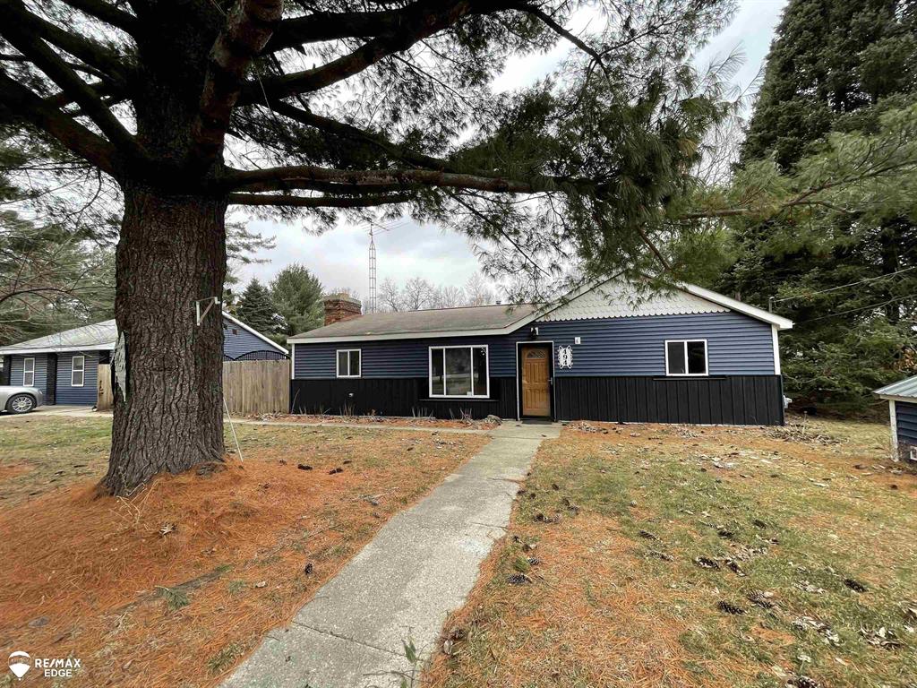 Discover the ultimate country "Trifecta" in this unique 10-acre estate, perfectly situated within the North Branch School District and just 50 feet from the pavement. This expansive property features two separate homes and a 24 x 40 pole barn, providing endless possibilities for multi-generational living, a dedicated guest house, or a rental opportunity. The primary residence is designed for comfort and style, boasting three spacious bedrooms, a large open-concept living area, and a primary suite with ample closet space and custom bathroom built-ins. You will be captivated by the unique custom metal and woodwork throughout the interior, which is beautifully complemented by fresh paint and modern vinyl plank flooring. The outdoor space is a true nature lover's paradise, offering a diverse landscape that includes private wooded trails, a serene cedar swamp, and direct frontage on the Flint River. Practicality meets charm with separate fenced-in areas designed for both gardening and pets, complete with a convenient pet door for easy indoor-outdoor transitions. With the added benefit of natural gas and a breathtaking setting, this property offers a rare combination of rustic seclusion and modern convenience. Whether you are walking the riverfront or enjoying the custom details inside, this is a home that truly must be seen to be appreciated. Shown by appointment. Call today!