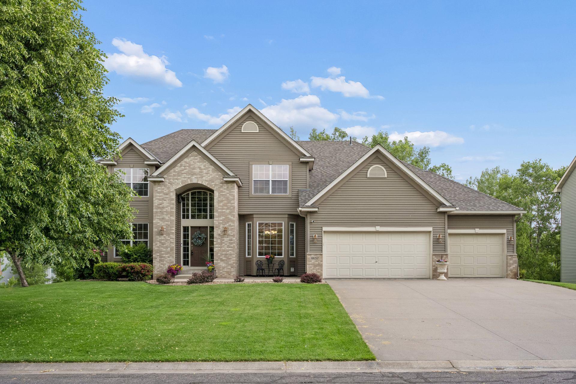 Sensational two story, former Model Home, in attractive Hillside Farm neighborhood. Nearly 4400 finished square feet in this well maintained one-owner home. Main floor features  welcoming living room with two sided look-through fireplace. Gourmet center island kitchen with stainless appliances, comfortably open to eat-in kitchen and main floor family room with cozy two sided look-through fireplace. Adjoining formal dining with small butlery.  Kitchen walks out to a spacious deck overlooking pond and attractive landscaping. Convenient main floor laundry. An open staircase brings you to the four upper-level bedrooms including a spacious primary suite with a full bath including jetted tub. Lower level is a marvelous entertaining space with wet-bar. 5th bedroom currently serves as a large workout space. Plenty of storage  throughout! Home features include:  Newer roof (2023), Furnace (2020), AC (2017), Hot water heater (2025). Dishwasher (2017). New Deck (2025). NEST security System. Beautiful Home. Exceptional value! Hurry to this one!