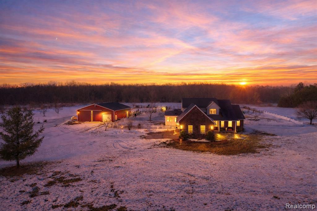 Discover the perfect blend of modern luxury and homesteading heritage in this meticulously maintained 3,050 sq ft split-level home, cherished by only two owners since 2001. Situated on 10 sprawling acres, the interior shines with a fully updated kitchen, fresh paint, new fixtures, and stylish LVP flooring throughout the lower level. The functional layout features a coveted first-floor primary suite and a cozy sunroom anchored by a gas fireplace, while a dedicated mudroom addition leads to the oversized 2-car garage. Peace of mind comes standard with a new furnace (2024). Outside, the property is a true producer's paradise, featuring a mature orchard of peach, cherry, apricot, apple, and pear trees, alongside two full-sized chicken coops, a pig pen, and a horse stall. The massive barn with a heated shop offers the ultimate workspace for any hobbyist or professional. This rare estate seamlessly combines move-in-ready comfort with the infrastructure to live your farmhouse dreams.