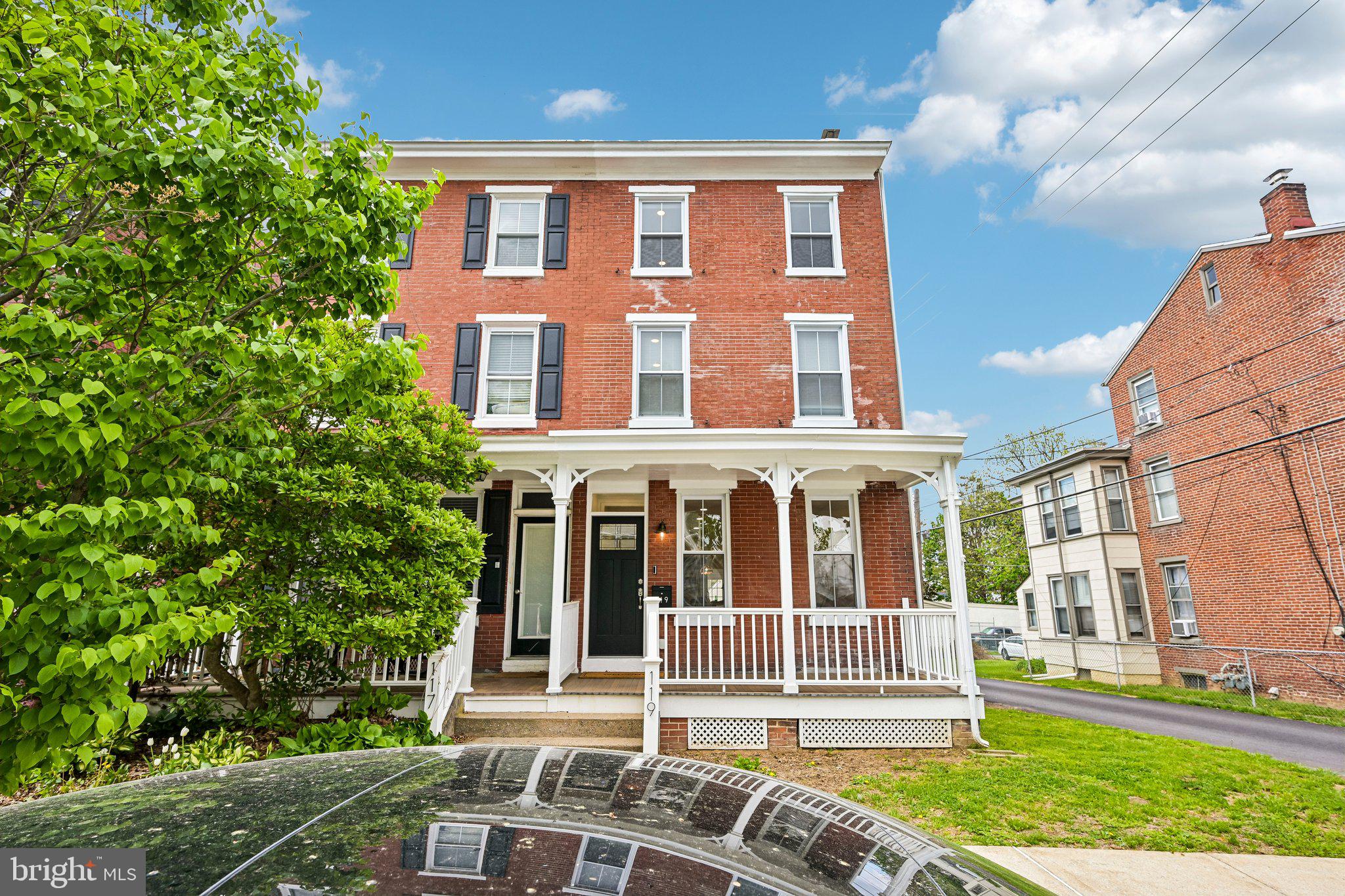 Welcome to this twin home completely remodeled in 2025 located in the heart of West Chester Borough, where modern updates meet classic charm in an unbeatable location. Enter onto the spacious covered front porch and into a bright, open-concept main level filled with natural light and beautiful hardwood floors throughout. The inviting living room flows seamlessly into the beautifully updated eat-in kitchen, featuring stainless steel appliances, an island with seating, abundant counter and cabinet space, and a stylish tile backsplash—perfect for both everyday living and entertaining. Just beyond the kitchen, a functional mudroom provides convenient access to the off-street parking pad. This area also offers a thoughtfully designed full bathroom with a walk-in shower, along with a separate, dedicated laundry room tucked neatly away. Upstairs on the second level, you’ll find three generously sized bedrooms, all serviced by a full hall bathroom with a tub/shower combination. The third floor is a true retreat, showcasing a private primary suite complete with a striking brick accent wall panel, an expansive walk-in closet, and a luxurious ensuite bathroom featuring a dual vanity and walk-in shower. The full basement is clean and well-maintained, offering excellent storage space. Located just blocks from downtown West Chester, this home puts you at the center of it all—enjoy a vibrant nightlife scene, endless dining and shopping options, and a constantly evolving selection of new restaurants. It’s also conveniently close to West Chester University, just a short 7-minute drive to the Exton SEPTA/Amtrak station for easy commuting to Center City Philadelphia or even New York City, and only 30 minutes to Philadelphia International Airport. This is a rare opportunity to own a fully renovated home in one of Chester County’s most desirable and walkable communities. Mortgage savings may be available for buyers of this listing.