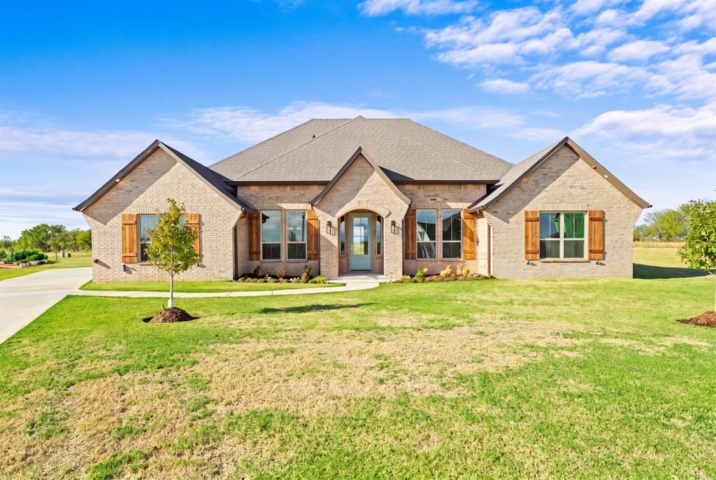 Serene nearly an half-acre escape nestled within the gated community of Antons Landing offering a tranquil natural setting with easy access to everyday conveniences. Exceptionally detailed home thoughtfully designed to capture the feel of a true custom build.  The interior features a unique warm neutral color pallet making every room feel connected and peaceful.  4 bedrooms, 3 stylishly designed full baths, 2 dining, and centralized open kitchen & living areas loaded with high-end & stylish finishes! 3 way split for privately located bedrooms, large laundry room with sink and a convenient drop zone with mud bench provides the ultimate transition point for shoes, jackets, purses and shopping bags with additional storage when entering from the garage!!  The spacious kitchen features large center island, Quartz countertops, floating wood shelves, lots of work space & tons of storage and high ceilings with wood beams!  Living Area is light and bright with wall of windows, crown molding, exceptional bronze finish on the gas log fireplace and stunning designer lighting! Wood look ceramic planked floor throughout with carpet in the spacious bedrooms for additional comfort!  Primary ensuite provides 2-in-1 closet with ample hanging, shelving, separate built in chests and walk thru to laundry room! Small flex room for optional use i.e. study, workout, storage, etc. is located off the drop zone/back hallway. Additionally included is a Large storm shelter, sprinkler system and spray foam insulation in exterior walls and roof. Don't miss all the details and designer finishes throughout!  Call us for your private tour!
