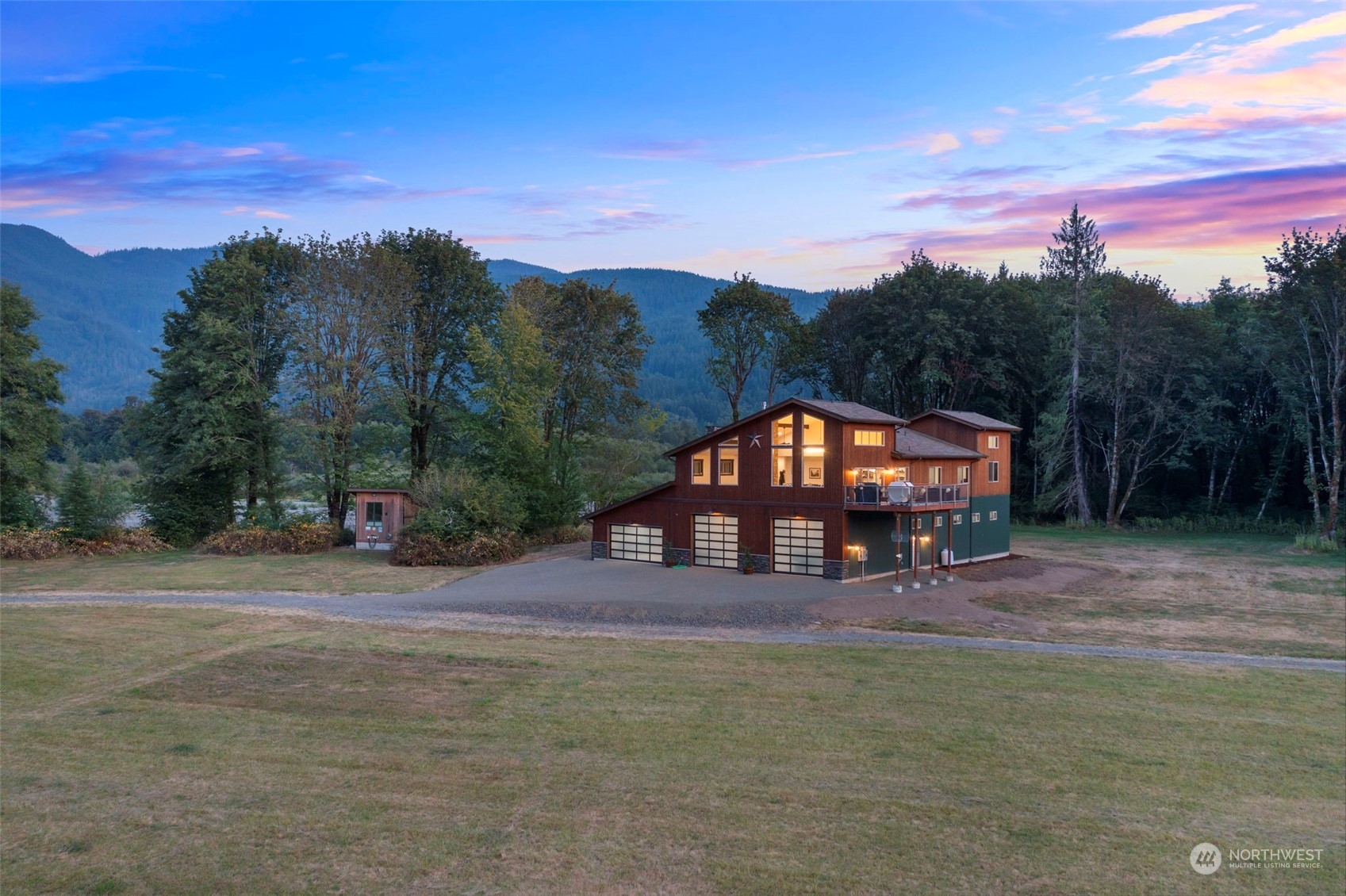 Unique 78 AC paradise with stunning mountain views! Newer 3732SF custom home, w/ 4784SF garage, features an open-concept design, soaring ceilings, and picturesque windows, perfect for a venue, equestrian or agriculture center. The gourmet kitchen boasts Café appliances, double gas ranges/ovens, a grand island & walk-in pantry, flowing to dining room w/ entertainment deck/hot tub and a spacious living room w/ rock fireplace. Master suite offers a walk-in closet and spa-like bath. Two large bedrooms, a den, laundry room, and ample storage. The 80x80 barn has 50AMP hookups, private hunting grounds, river access, and space for an airstrip. Minutes from hiking, White Pass skiing, fishing, this elk sanctuary blends luxury, nature, & adventure.