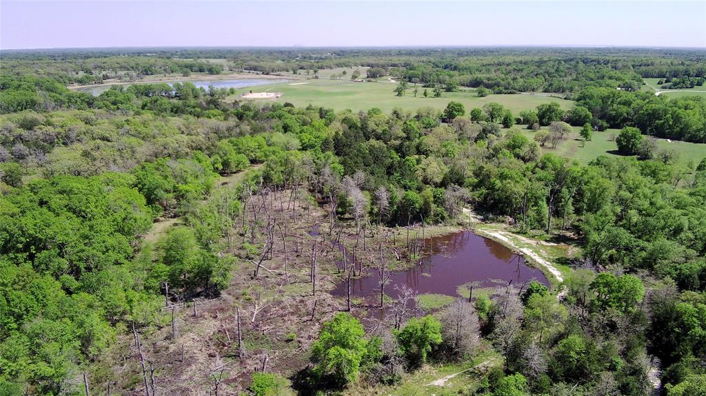 The Turkey Creek Ranch is an ideal recreational getaway located 1-hour from Waco and 2 hours from Houston, Austin and DFW. 
The property is 95% heavily wooded with over 2,000 feet of the live-water Turkey Creek that traverses the western boundary. The other 5% of the property is cleared open native pastures ideal for hunting deer, hogs, and predators and ATV trails that provide access to the majority of the property. 
There are two large ponds stocked with fish and fed by wet-weather creeks and draws from the elevation at the NE corner of the property. The ponds are also frequented by wood ducks and other migratory waterfowl. There is a 720 sqft 2 BR and one and 1.5 Bath cabin, carport and three 20’ shipping containers located on the NE high ground, all supported by a water well into the Carrizo-Wilcox Aquifer and Navasota Valley Coop electricity. There is also an old, single-room hunting cabin towards the front of the property that can be renovated. There is an active natural gas production pad on the SW corner of the property with a 500 sqft metal garage with dual roll-up doors, a pipeline that traverse the property from E to W, and an all-weather service road that traverses down the center of the property from N to S.
There are two property entrances and 800’ of road frontage along State Highway 164.
Property is partially fenced and will be ag-exempt beginning in 2026.
No seller-owned minerals.
Seller will consider subdividing the property.