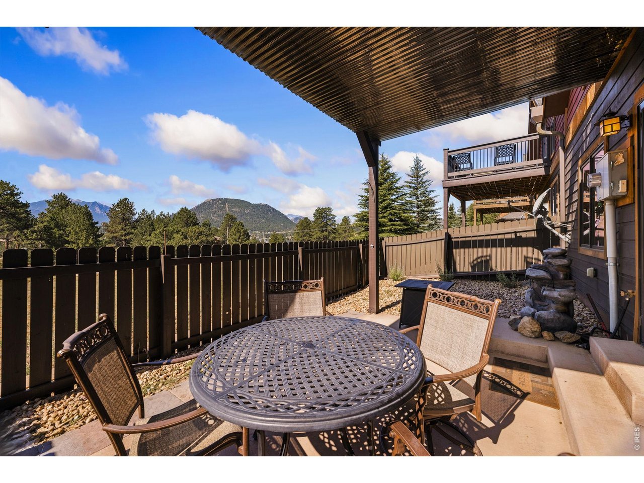 Accepting backup offers on this Accommodations zoned fully-furnished luxury end-unit townhome IN TOWN!! Part of a 12-unit community all zoned A, Unit is impeccably maintained with beautiful exterior & interior finishes, ready to be your vacation home AND income property, as short-term rental use is not subject to Town permit cap with A zoning. Stone & timber exterior, vaulted ceilings, knotty alder cabinetry, granite kitchen, solid craftsman doors & gorgeous stone fireplace inside. Spacious, open floor plan perfect for entertaining, the income potential is huge. Enjoy the incredible, unobstructed views of Twin Sisters and the Continental Divide from the fenced patio or the generous upper level deck. Fantastic location in the heart of Estes with easy access to the Lake Estes Trail, 9-hole Golf Course & Downtown.