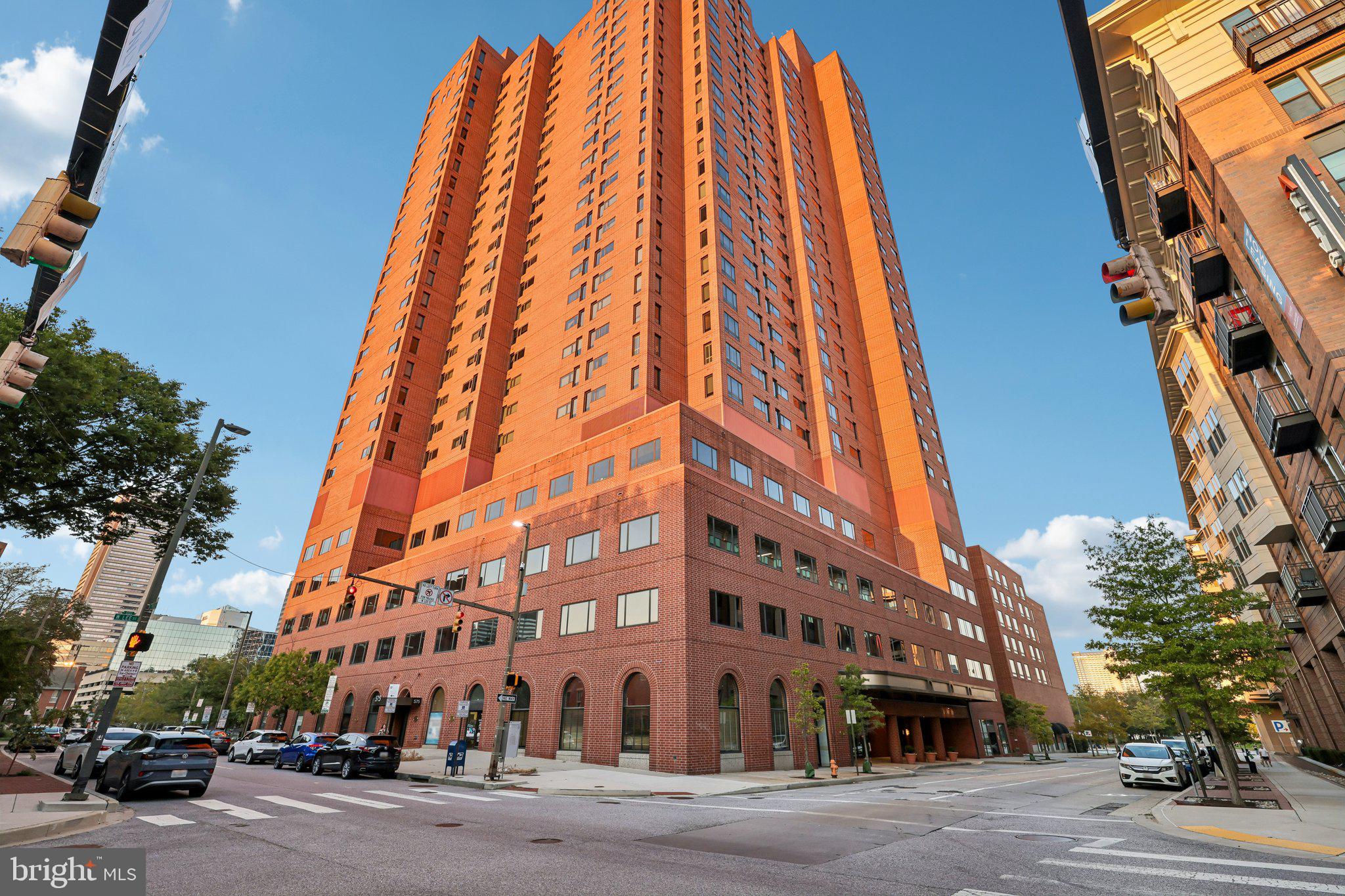Welcome to 10 E Lee St #802, where you can enjoy spectacular water and Baltimore skyline views from this 2-bedroom, 2-bathroom condo in the heart of Baltimore. The spacious interior features no carpet for easy maintenance, large closets, and a primary bedroom with an attached bath. The updated kitchen offers ample cabinetry, stainless steel appliances, and recessed lighting, while a stackable washer and dryer add everyday convenience. A deeded indoor garage parking space is included. Located in a full-service building with a doorman, 24-hour front desk, elevator, and access to building amenities. The building's hotel gym and pool are available for a separate fee and are not included in the HOA. Ideally located near the Inner Harbor, National Aquarium, waterfront promenade, Camden Yards, M&T Bank Stadium, Federal Hill, Harbor East, dining, entertainment, and city attractions, with the University of Maryland's Medicine, Nursing, Pharmacy, and Law schools all nearby. Convenient access to I-95 and I-295 also makes travel a breeze.