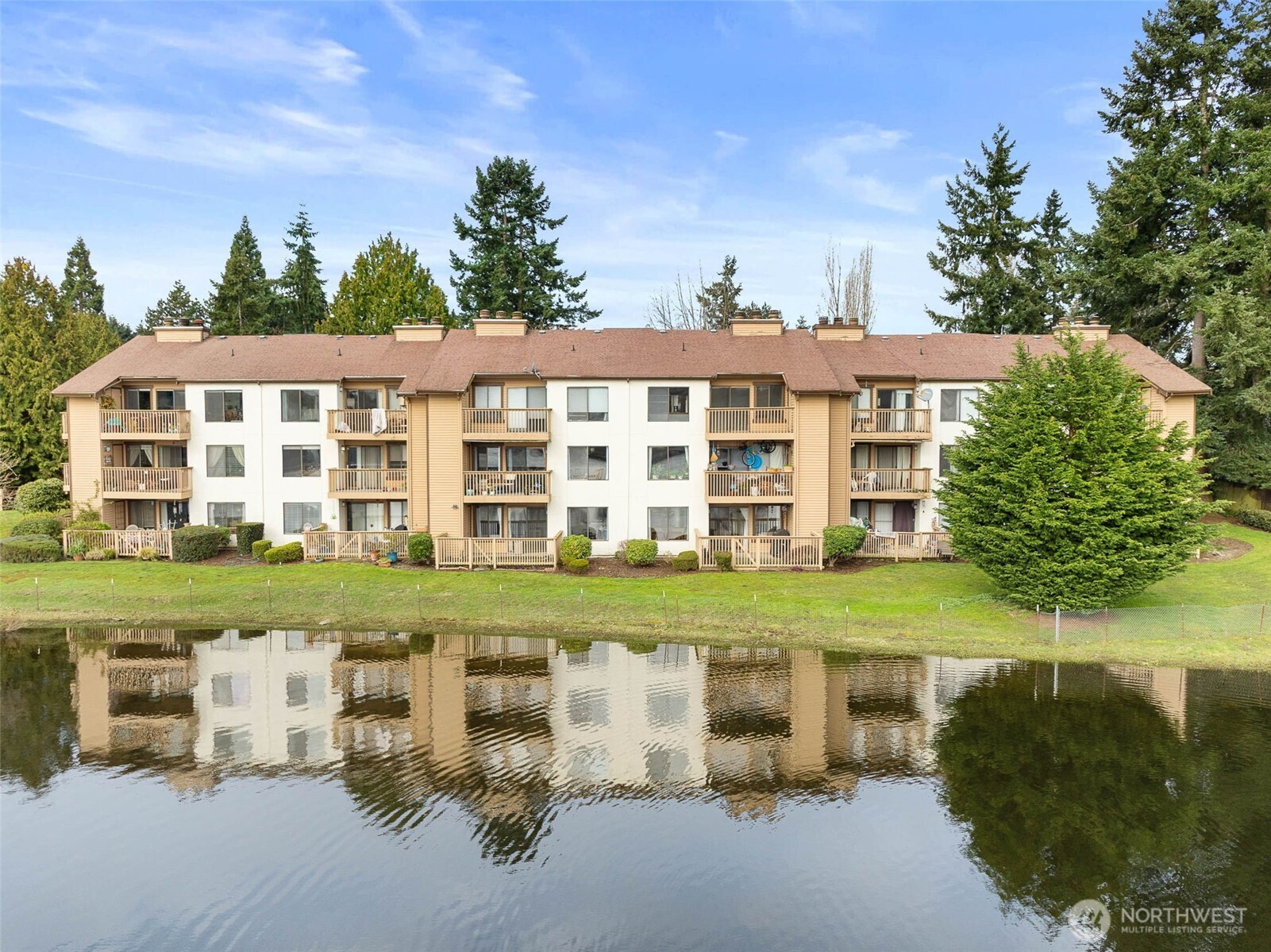 Lakeside Village retreat in the heart of the Federal Way this beautifully upgraded 2-bedroom, 1 3/4-bath condo offers sweeping views of the picturesque lake from your patio, dining room & living room. Living room features wood burning fireplace. Featuring an updated kitchen with quartz counters, newer appliances, newer flooring, newer cabinets, updated bathrooms with tile finishes. Close to new light rail station, schools, restaurants, all conveniences, public transportation & freeways for an easy commute in any direction. Community features outdoor community pool, an athletic court, lots of parking options including a covered carport. FHA & VA Approved Condo!