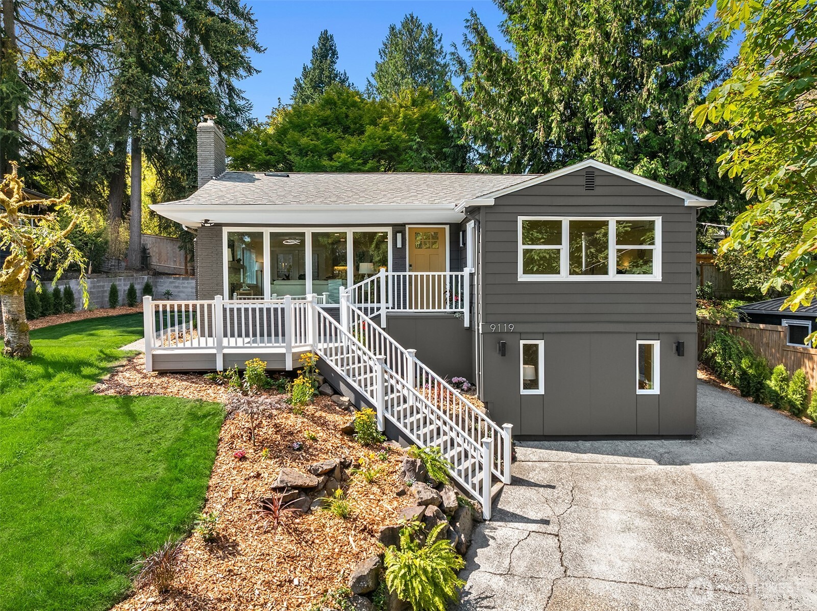 Welcome to this fully permitted, thoughtfully reimagined 4-bedroom, 3-bathroom home in Seattle’s sought-after Maple Leaf neighborhood. Designed for style and functionality, this stud-out renovation features new plumbing, new electrical system, new heating/cooling system and an abundance of windows that fill every level with natural light.  Exceptional curb appeal welcomes you with fresh landscaping, new siding, new exterior paint, upgraded windows, a new roof, and a charming front porch. Inside, sunlit interiors unfold into an open-concept living space. The chef-inspired kitchen boasts sage oak cabinetry, faux stone countertops, a designer tile backsplash, and brand-new appliances. The adjoining dining area opens through French doors to a new deck & paver patio, extending your living space outdoors for dining & entertainment.  Privately set on the main level, the primary suite features a 3/4 ensuite bath with elevated finishes. A second main-floor bedroom offers flexibility for guests or a home office, complemented by a chic powder room. Downstairs, two additional bedrooms and a full bath provide extra space for guests or lifestyle needs.  Outside, enjoy a private yard perfect for relaxing, gardening, and entertaining. Situated on a quiet street with plenty of parking space on driveway and off street, walk to park, school, amenities, and major commuter routes, this home offers the ideal mix of comfort and convenience.  Come take a look—you may have just found your next home!