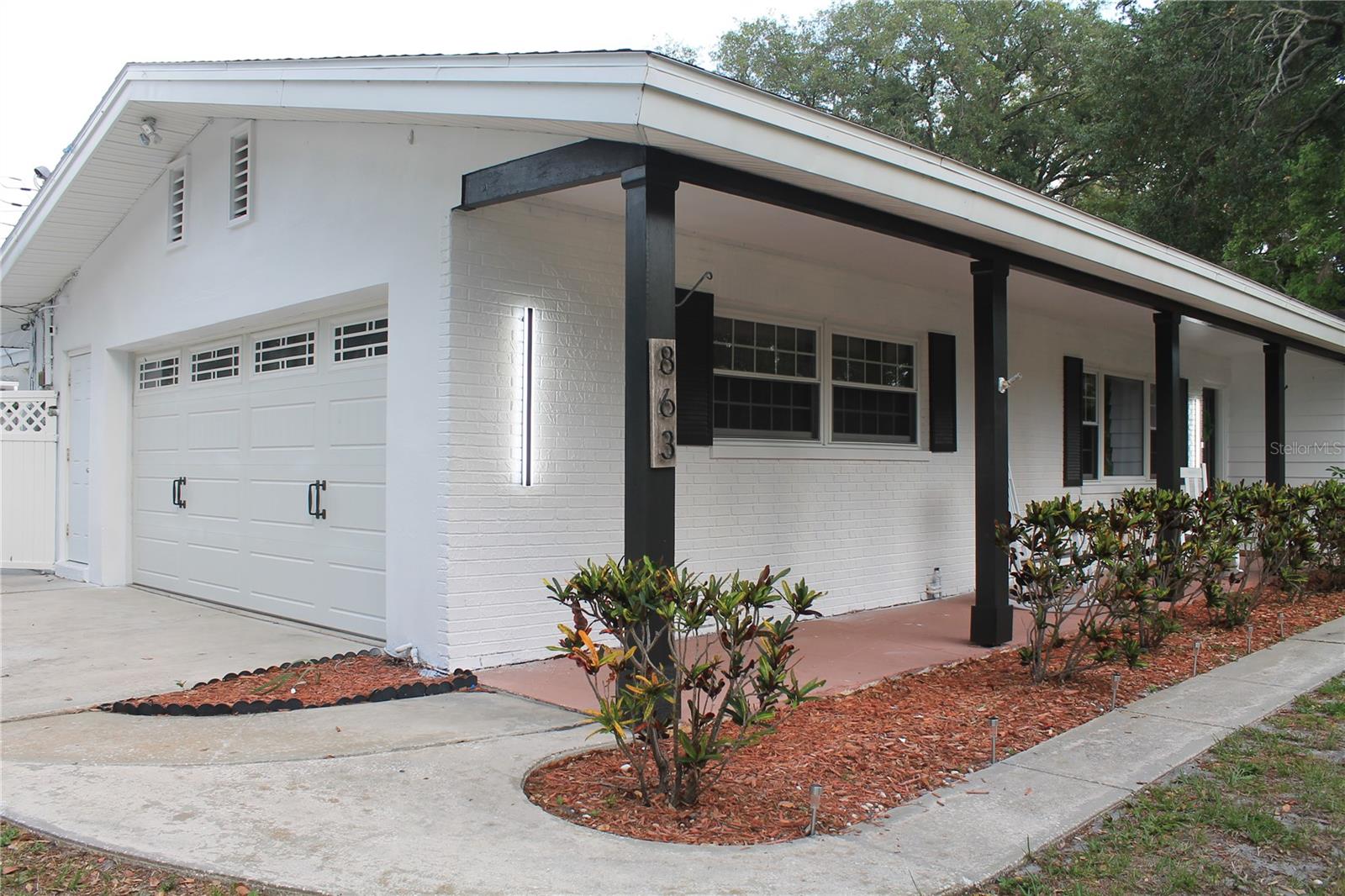 Freshly painted POOL HOME with Newly Updated Pool Deck and oversized screened in Lanai with epoxy floor including a putt golf for entertainment - 5 minutes to Indian Rocks Beach and Belleair Causeway Boat Ramp nestled on a double lot. Spacious 3-bedroom, 2-bathroom over 1,725 sq. ft. of living space and large front porch. This home features a primary bedroom, with views of the pool, boasts a spacious walk-in closet with an updated ensuite bath, including a walk-in shower and jetted tub. The kitchen features newly installed stone countertops and backsplash with stainless steel appliances NEW dishwasher, and a pantry. Two more bedrooms and a full bath complete the home in this split floor plan. Additional features include a large oversized 2-car garage with laundry room and NEW water softener. Located in a NON-FLOOD zone, (no storm damage or impact). This home offers the perfect balance of privacy and convenience. 1 mile to Taylor Park and Pinellas Trail, easy access to downtown Largo including Largo Central Park, healthcare facilities, and an easy commute to Clearwater Beach, St. Petersburg, PIE Airport and Tampa International Airport. You’re a breezy drive away from catching your own ocean breeze at Bay Breeze Terrace.*Option to purchase fully furnished. *Short term rentals permitted.