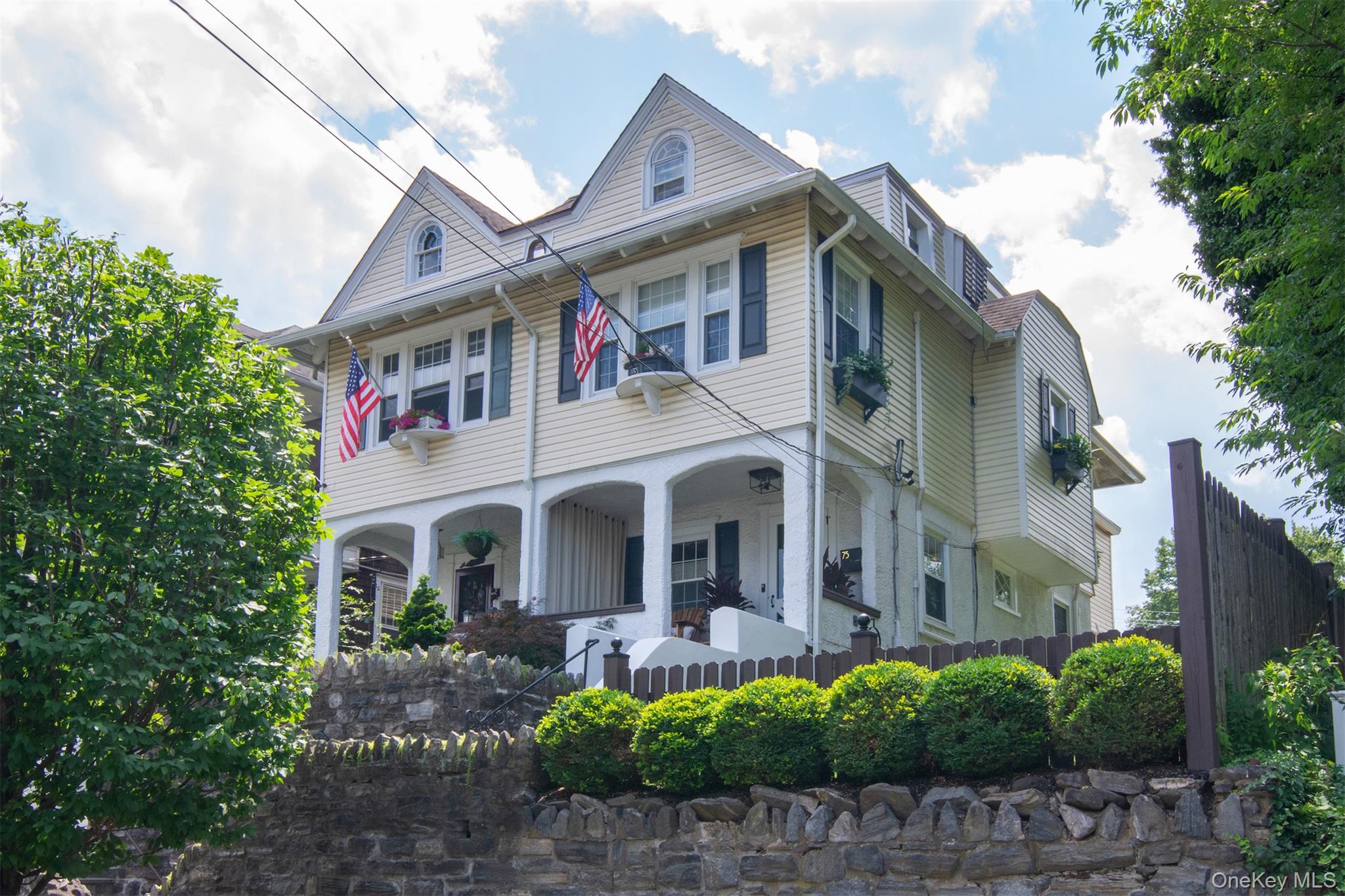 This charming and unique home could be just the place you've been looking for. Nestled on a quiet street, this 1906 Colonial stands out with beautiful architectural details, warm character, and a location that allows you to walk everywhere. High ceilings, original moldings, wood floors, and thoughtfully preserved vintage touches throughout, open flow living rooming, dining area and thoughtfully updated kitchen with stainless steel appliances and stone countertops. On the second floor, the high ceiling height continues with spacious primary bedroom, updated full bath, second bedroom and third bedroom, currently used as an office. Third floor is additional bonus space for storage or other uses. Basement is large, walk out, great ceiling height where you can find more storage space, mechanicals, washer/dryer and walk out to reach side yard. Outside is a tranquil, private and peaceful fenced in yard with beautiful patio and porch for grilling and/or relaxing and admiring the incredible plantings that the owner has worked on meticulously. The front porch will be hard to leave once you sit down and enjoy your coffee, book, cocktail and lovely breeze. Outside stone work is meticulous, house comes equipped with a generator and sprinkler system. 
Located within easy walking distance to the Bronxville Metro North Train Station, village shops, restaurants, a movie theater, library, dog park, and the in-season Farmers' Market, convenience is at your doorstep. Plus, enjoy quick access to parkways for easy commuting. It really is a special and charming place to call home. Street parking is easy, due to strict parking rules for non residents.