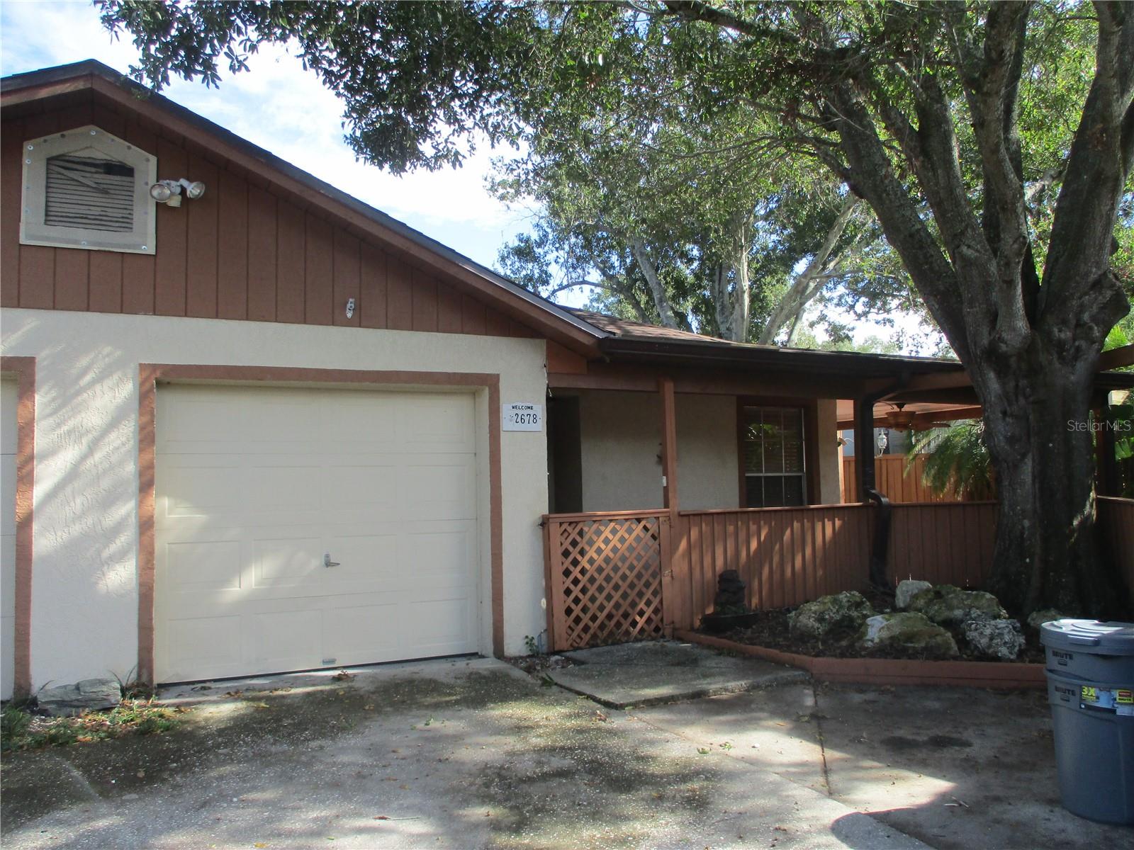 Great starter home, vacation home, retirement home....etc.  This is a 2 bedroom, 2 bath with a den/office.  It has a larger than typical fenced rear yard, plenty of room for a garden area.  There are two custom-built frame storage units and includes an attached 1-car garage.  The home has been maintained and includes all appliances; it has a new roof 2025.  There is a nice front entry porch that wraps around to a wood deck/patio area.