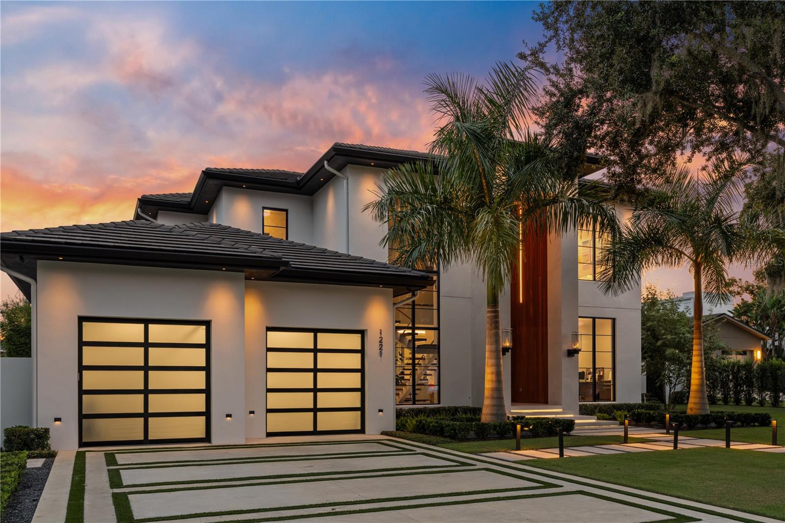 Now offered with a significant price improvement, this award-winning custom residence presents a rare opportunity in Winter Park’s sought-after Virginia Heights neighborhood, prized for its proximity to Park Avenue, placement within an A-rated school district, and deeded access to the Winter Park Chain of Lakes. Created by an award-winning builder as a personal family residence, this home reflects a level of craftsmanship and finish typically reserved for private custom builds. Soaring ceilings, walls of glass and an open-concept layout create seamless indoor-outdoor living ideal for everyday comfort and elevated entertaining. The chef’s kitchen is complemented by bespoke custom cabinetry throughout the home. Covered outdoor living areas and a summer kitchen enhance year-round enjoyment, highlighted by a custom rain curtain that transitions into an outdoor movie screen. The primary suite offers a private retreat with spa-inspired finishes and generous closet space, while additional bedroom suites provide flexibility for family, guests or home office use. Smart home features and refined finishes are found throughout. Owner may consider select furnishings as part of a separately negotiated, acceptable offer. Private showings by appointment.