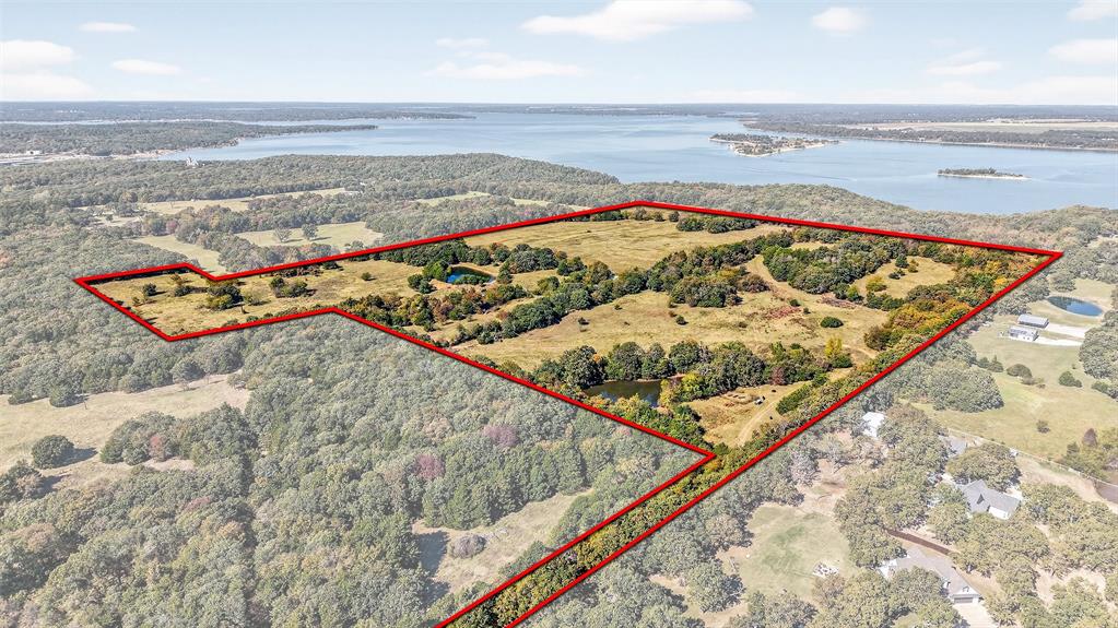 72.75 Acres of Lakefront Opportunity on Lake Texoma Discover a rare chance to own 72.75+- acres of prime lakefront land on the shores of Lake Texoma, perfectly positioned adjacent to Corps of Engineers property with direct lake access by walking down to the beach. This exceptional tract combines wide-open potential with unparalleled natural beauty, making it ideal for farming, ranching, hunting, fishing, or creating your dream lake retreat. Gently rolling terrain, panoramic water views, and vistas overlooking the lake’s iconic islands create an unbeatable backdrop for anything you envision. Whether you want to build a private getaway, develop a recreational haven, or operate a working ranch, this land offers true do-it-all versatility. Opportunities like this are rare—experience freedom, privacy, and the best of lake life all in one extraordinary property on Lake Texoma.