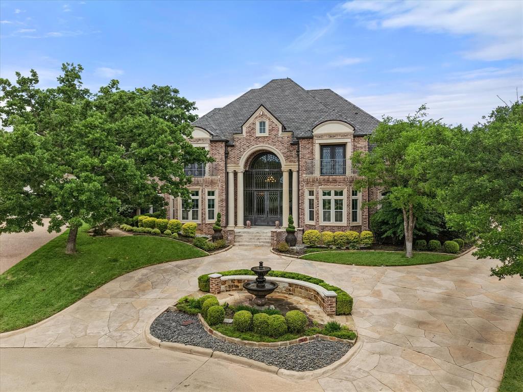 Welcome to this meticulously maintained residence in one of Arlington’s most sought after areas. This stunning home offers luxury living on a spacious landscaped .86 acre lot within an exclusive 9-acre community featuring 2 ponds, walking trails and a basketball court. Designed for refined living and seamless entertaining, this four-bedroom four and a half bath home exudes sophistication and comfort at every turn. The spacious living areas are enhanced by natural light, high ceilings and elegant finishes. Travertine and engineered wood flooring throughout, multiple living areas and a bar upstairs—ideal for entertaining. The home includes two primary suites offering flexible living options. Enjoy a beautifully landscaped backyard with several seating areas, a covered patio with built-in grill, built in heaters and motorized shades for year round comfort. The heated pool and hot tub are surrounded by a full-yard surround sound system creating a true outdoor retreat. This is a rare opportunity to own a luxury home in a prime Arlington location within a gated community where elegance and lifestyle come together.