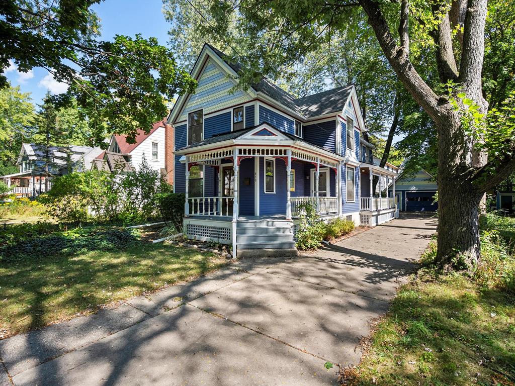 Charming Victorian nestled in the heart of Ann Arbor's highly sought-after Water Hill neighborhood. With over 1,500 square feet of character-filled living space, this home offers the perfect blend of historic charm and modern layout. The main floor is adorned with original hardwoods throughout, spacious living room, a flexible main-floor bedroom that also makes a great home office , and an open-concept dining area that flows into the kitchen, complete with SS appliances.  The oversized 2nd level primary room is filled with natural light and overlooks the private backyard. Step outside to enjoy the inviting wraparound front porch which is perfect for relaxing or taking in the annual Water Hill Music Fest. Walking Distance to Kerrytown, minutes to UM, and steps from the Huron River! Roof 2016, Water Heater 2018.