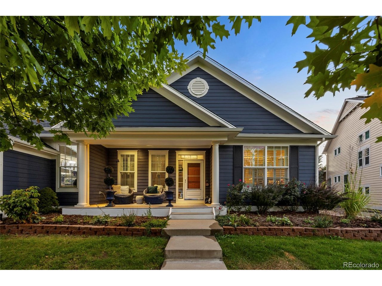 Now offered at $1,185,000, this beautifully refreshed residence represents an exceptional value in the highly sought-after Indian Peaks community. Full 1% seller credit with our preferred lender. Recent enhancements, including refreshed interior finishes and new basement carpeting, complement its move-in-ready presentation and timeless appeal.Set against coveted HOA open space with direct access to the scenic bike trail connecting White Hawk Ranch to Old Town Louisville, the home enjoys an idyllic setting surrounded by mature aspens, towering pines, and protected green space. A beautifully designed flagstone patio and outdoor fire pit provide an inviting backdrop for entertaining or relaxing beneath the Colorado sky.Inside, the updated gourmet kitchen features a generous center island and flows seamlessly into the expansive, light-filled family room with soaring 16-foot ceilings, dramatic floor-to-ceiling windows, custom built-ins, and a striking three-sided fireplace. The spacious formal dining room shares the warmth and ambiance of the fireplace, creating an elegant setting for gatherings both intimate and grand.The generously sized main-floor primary suite offers a private retreat with a five-piece bath and walk-in closet, while a dedicated main-level office provides ideal work-from-home flexibility. Upstairs are three additional bedrooms, including two connected by a Jack-and-Jill bath, an additional guest bath, and a versatile loft with designated study space.Designed for entertaining, creativity, and comfortable guest accommodations, the finished basement includes a 300-bottle wine fridge, expansive recreation area, artist studio, guest bedroom, and full bath. An oversized 2.5-car garage with ceramic-coated flooring and thoughtfully designed organizational space completes the home.A rare opportunity to enjoy refined Colorado living, exceptional space, and direct access to trails and open space in one of Lafayette's most desirable communities.