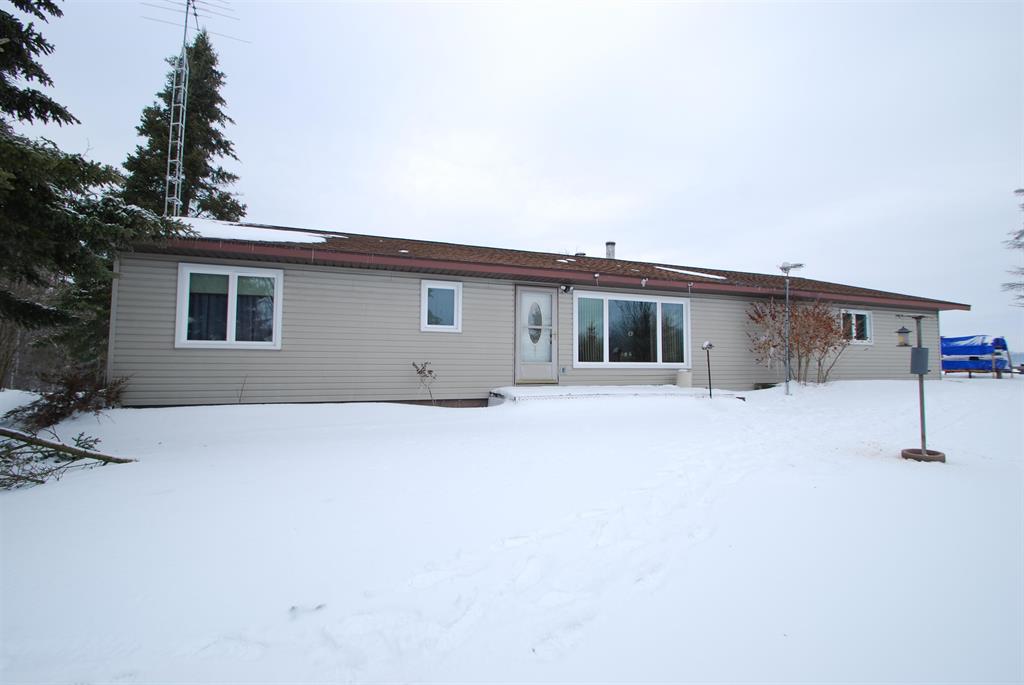 Sitting on a picturesque hilltop with beautiful views all around, this 3 bedroom, 2 bath ranch style home on 22.8 acres is just minutes from downtown West Branch featuring great shopping, dining, entertainment and more. This home has many updates including new windows in 2020 (with transferable warranty), a new water heater in 2024 and an asphalt driveway installed in 2024. There is an above ground pool with all equipment needed minus a liner. There is plenty of space for storage with there being an attached garage (heated for car buffs) and 2 other outbuildings as well. This one won't last long!