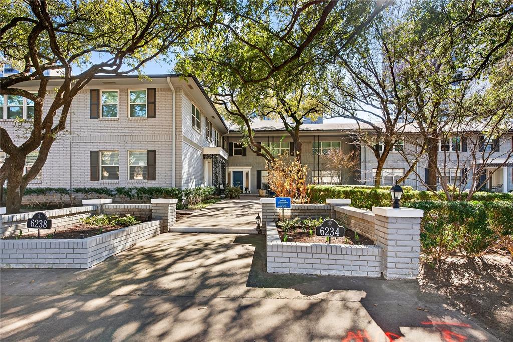 Tucked behind the iconic Pink Wall, this beautifully renovated 2-bedroom, 2-bath residence offers turnkey living in one of Dallas’s most sought-after enclaves. Hardwood floors and a cozy fireplace anchor the main living area, creating a warm, inviting space for both everyday living and entertaining. A private study off the living room adds flexibility and is a rare feature for this unit.Newly installed windows fill the home with natural light and provide peaceful treetop and pool views. The updated kitchen features custom cabinetry, quartz countertops, a stylish backsplash, recessed lighting, and premium appliances, thoughtfully designed for both form and function.The spacious primary suite includes an updated bath with a framed glass shower, quartz countertops, and a stacked washer and dryer for added convenience. The secondary bedroom offers its own ensuite bath with upgraded finishes.The HOA covers all utilities, common area maintenance, and access to the community pool. Two assigned parking spaces convey. This is a true move-in-ready opportunity where the renovations are complete and the lifestyle is effortless.