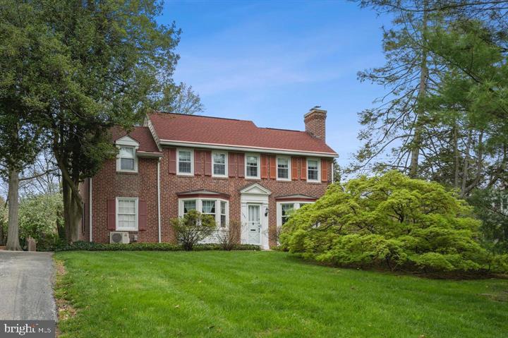 This beautiful Penn Valley colonial is located in the award-winning Lower Merion School District and is part of the high school choice zone. The home sits on nearly half an acre and blends classic charm with thoughtful modern updates, offering exceptional flexibility for today’s living needs.The first floor features a full-size bedroom and full bathroom, providing an ideal setup for guests, family, or live-in help. This level also includes gleaming hardwood floors throughout, a living room with a fireplace, a formal dining room with a walk-in coat closet, an open, airy eat-in kitchen, and large bay windows in both the living and dining rooms. Upstairs are three spacious bedrooms, including one with an adjoining sitting room and cedar closet—easily adaptable as a nursery, playroom, or dedicated workspace—along with a nicely updated hall bathroom.The basement has been upgraded with new flooring and is fully finished, offering additional living space for a den, gym, or playroom. The laundry room is located on the basement level, which also provides direct walkout access to the side patio/entertaining area. Recent improvements include updated lighting and a whole-house high-velocity central air system, replacing prior wall units for improved comfort and efficiency.Set on a large, flat lot with a one-car garage and driveway, this home is just minutes from the train, Suburban Square, Trader Joe’s, and the shops and restaurants of Narberth, Ardmore, and Bryn Mawr.