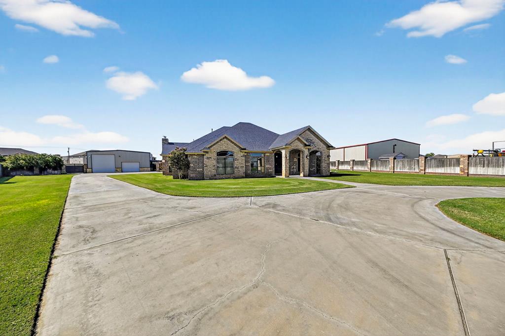 Spectacular Custom Home on over an acre with expansive lawns, plus hidden fenced areas for storage & extra parking. The 40X40 Shop is set up for work & play, with a covered patio for outdoor lounging while the inside is insulated & has storage cabinets, work bench & internet. Inside the home, you'll enjoy all of the storage & closet space, high ceilings and multiple living & dining spaces. Please take a look at the photos & 3D tour to get all of the details...then call your agent!