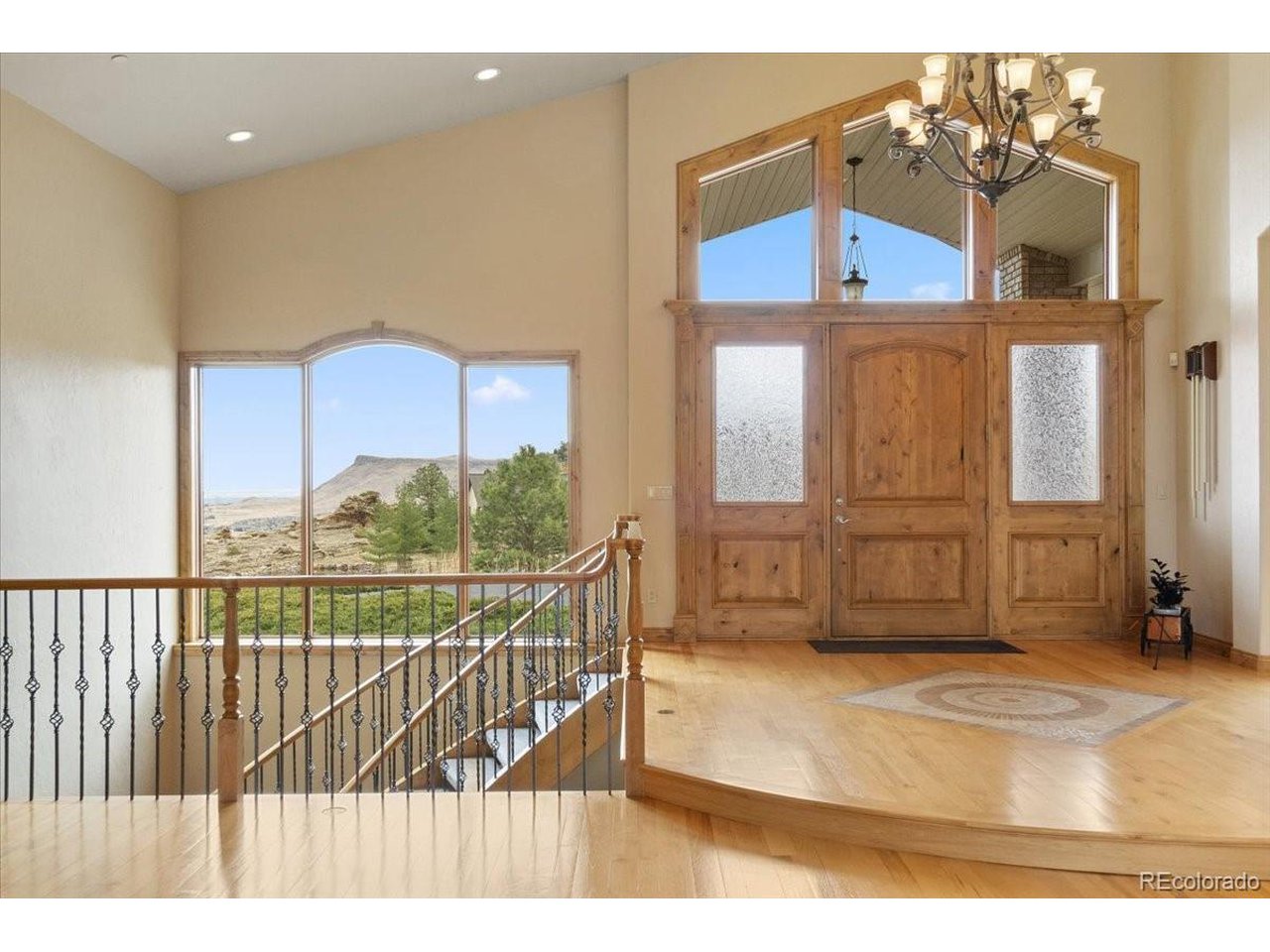 Welcome to the perfect Colorado Estate. Located in Bear Tooth Ranch and situated on over 70 acres in Golden with easy access to the mountains and highways and a short drive to downtown. Total square footage with the additional garage is 12,260 sf. Total square footage of the main house is 9,530 sf. The only 70 acre lot in the development and would be perfect to add equestrian facilities or any other facilities the small HOA approves. The main home itself is just under 10,000 square feet with everything a buyer could want. Walk into your glorious vaulted ceilings and wide open floor plan. This ranch style home is perfect for entertaining or hosting a large family. Equipped with top of the line appliances and custom granite countertops. The master suite is a glorious retreat in the home all custom and top of the line. With a large Jacuzzi tub, custom walk in shower and oversized master closet. Upstairs is composed of two other bedrooms, on being an all wood office. Proceed down the rounded staircase to the walkout basement. Equipped with a large open floor plan and full kitchen/bar. The movie theatre is nestled in the south corner with a custom seating. In the walkout basement you will also find 3 bedrooms and 3 full bathrooms with a second laundry room. The whole back of the home faces west with a large deck and walkout patio space, all custom built. In the attached garage there are 8 parking spaces and storage space. Proceed to the detached custom garage you will find an additional 9 spaces. The outdoor garage has doors large enough for RV storage and space to park any recreational toys you could want. In the detached garage there is an additional full kitchen and bath apartment. This oversized custom built home on 70+ acres is the epitome of Colorado living in Golden. The well and septic are maintained yearly and are in just like new shape.