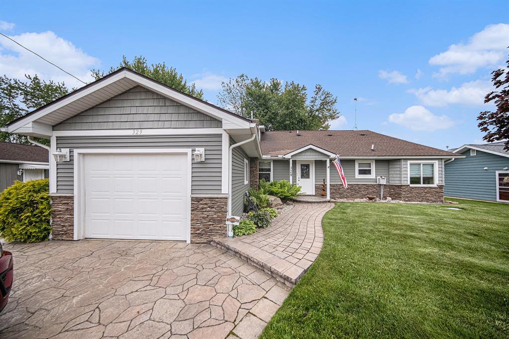 Experience the pinnacle of waterfront luxury in this stunning 4-bedroom, 2-bathroom lakefront estate. Nestled on a pristine shoreline where you can watch nesting swans, this home boasts breathtaking panoramic views through a full wall of floor-to-ceiling windows, flooding the open-concept living space with natural light. The heart of the home is a massive chef's kitchen featuring high-end appliances, custom cabinetry, and expansive Quartz countertops, perfect for entertaining or quiet mornings with a view. A grand dual staircase makes a striking architectural statement and leads to generously sized bedrooms designed for comfort and style. The upstairs bathroom is a true spa-like retreat, complete with heated floors for year-round comfort and luxury. Step outside to your fully finished