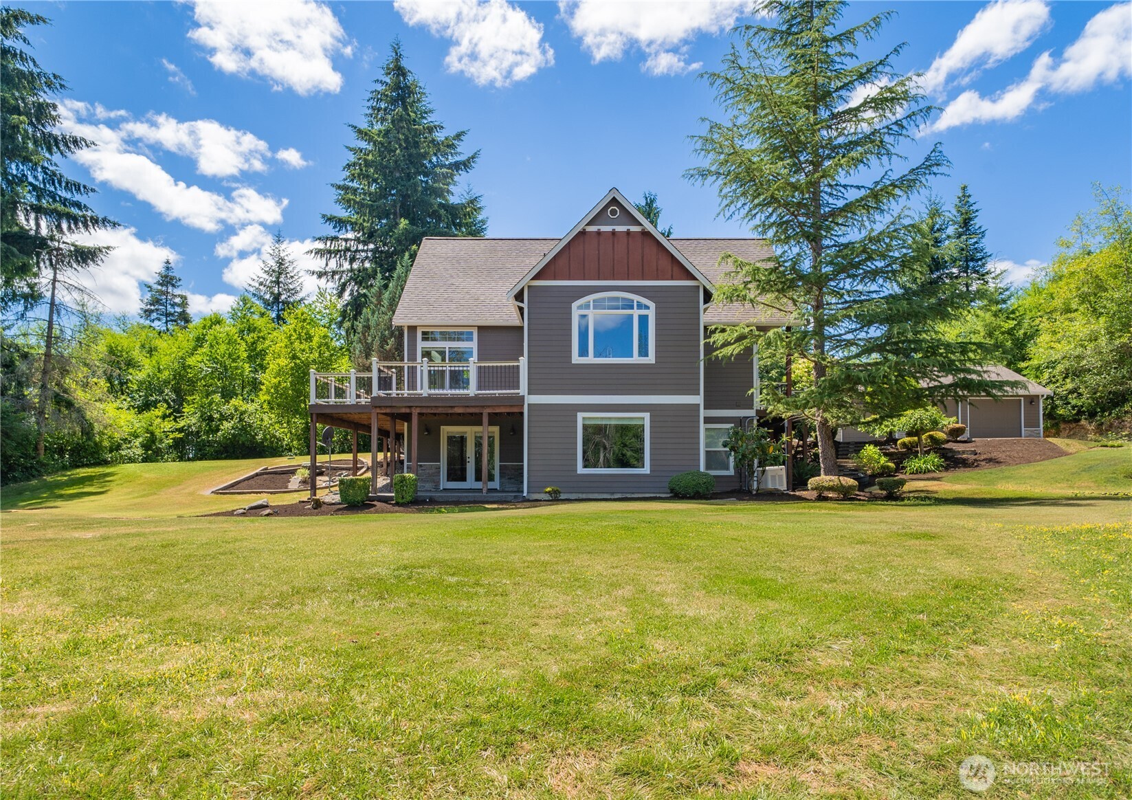 Enjoy peaceful rural Thurston County living with stunning Mount Rainier views! This beautifully updated home features a remodeled kitchen, luxurious primary bath, and modern finishes throughout. The gourmet kitchen offers a high-end gas cooktop, double wall ovens, quartz countertops, hardwood floors, and a large island with prep sink. The main-floor primary suite includes a walk-in closet, soaking tub, and walk-in shower. The daylight walkout basement features a wet bar, media room, recreation area, full bath, and potential ADU. Outside, enjoy a 30x50 shop, asphalt driveway, paver patio with fire pit, wraparound Trex deck, and generator-ready plug. This home is a must see!