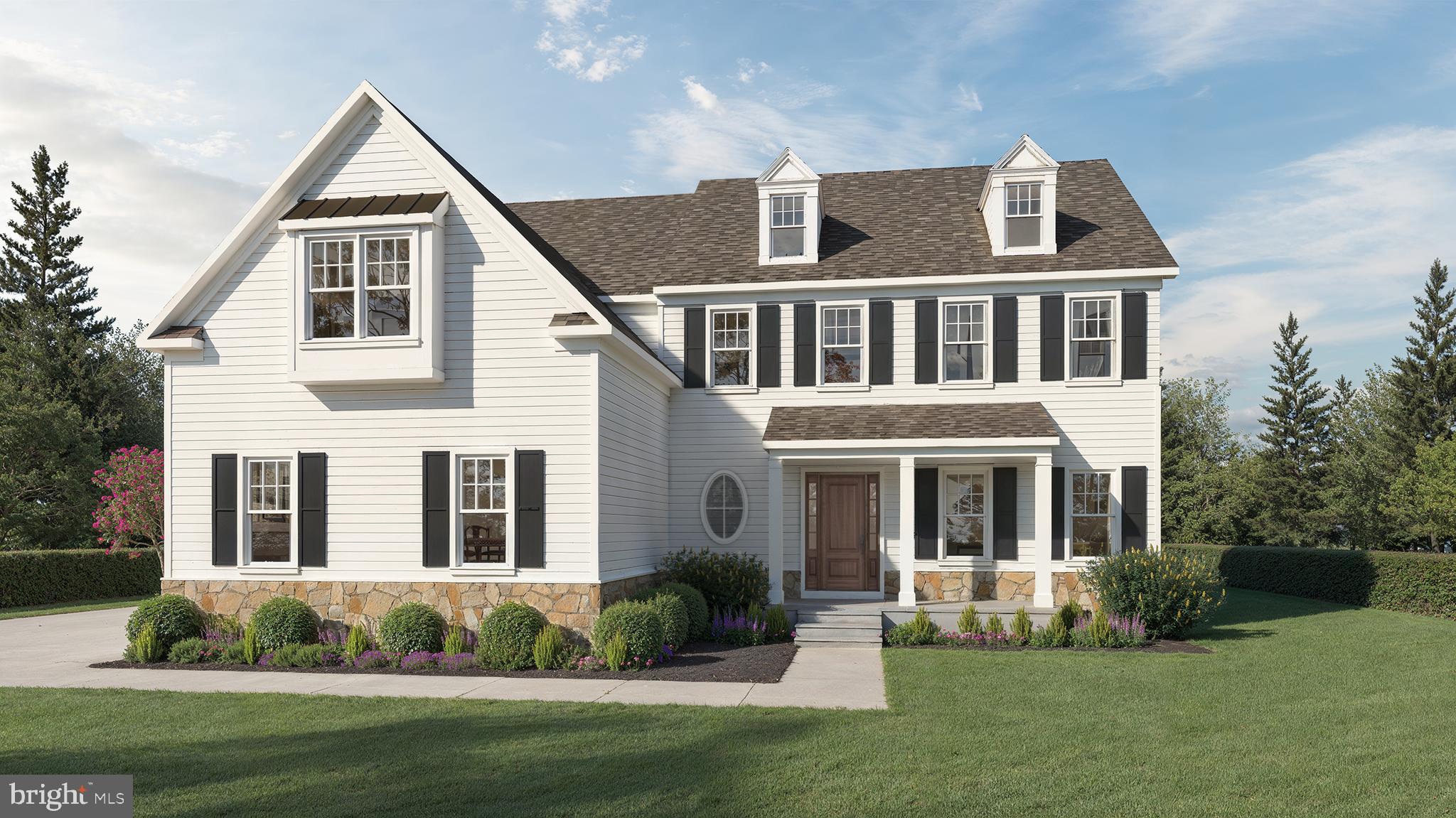 Experience timeless luxury at 0 Woodstock Road, a professionally designed home by Foxlane Homes, gracefully situated on a picturesque .6-acre homesite in the heart of Villanova. Encompassing over 5,100 square feet of refined living space, this meticulously crafted residence features 4 bedrooms, 4 full baths, 1 powder room, a first-floor owner’s suite, a finished basement with plumbing rough-in for a future bath, and a 3-car side-entry garage.Designed for both everyday living and effortless entertaining, the heart of the home is an inspired chef’s kitchen featuring custom white perimeter cabinetry, a rich walnut-stained island, Rhino White quartz countertops with a full-height matching backsplash, a statement sloped hood, floating shelves with gallery rails, designer lighting, and a complete suite of Sub-Zero, Wolf, and Miele appliances. A beautifully appointed butler’s pantry with beverage refrigeration adds both elegance and functionality.Throughout 0 Woodstock Road, warm white oak flooring, custom built-ins, solid-core doors, curated designer lighting, and timeless finishes create an elevated yet inviting atmosphere. The great room is anchored by a custom limestone fireplace, while the covered deck offers the perfect extension of the living space for quiet mornings or outdoor gatherings.The first-floor owner’s retreat is a true sanctuary, complete with a spa-inspired bath featuring Carrara marble, polished nickel fixtures, a frameless glass shower, and custom built-in mirrors. Upstairs, each secondary bedroom enjoys its own beautifully designed bath with thoughtfully selected finishes that reflect the home’s timeless aesthetic.Every detail has been intentionally selected as part of Foxlane Homes’ Designer Collection, delivering a home that feels layered, refined, and ready to love from the moment you arrive. From the classic James Hardie exterior with Chester County stone accents to the carefully curated interiors, this home offers a rare opportunity to own a professionally designed luxury home in one of the Main Line’s most coveted locations.