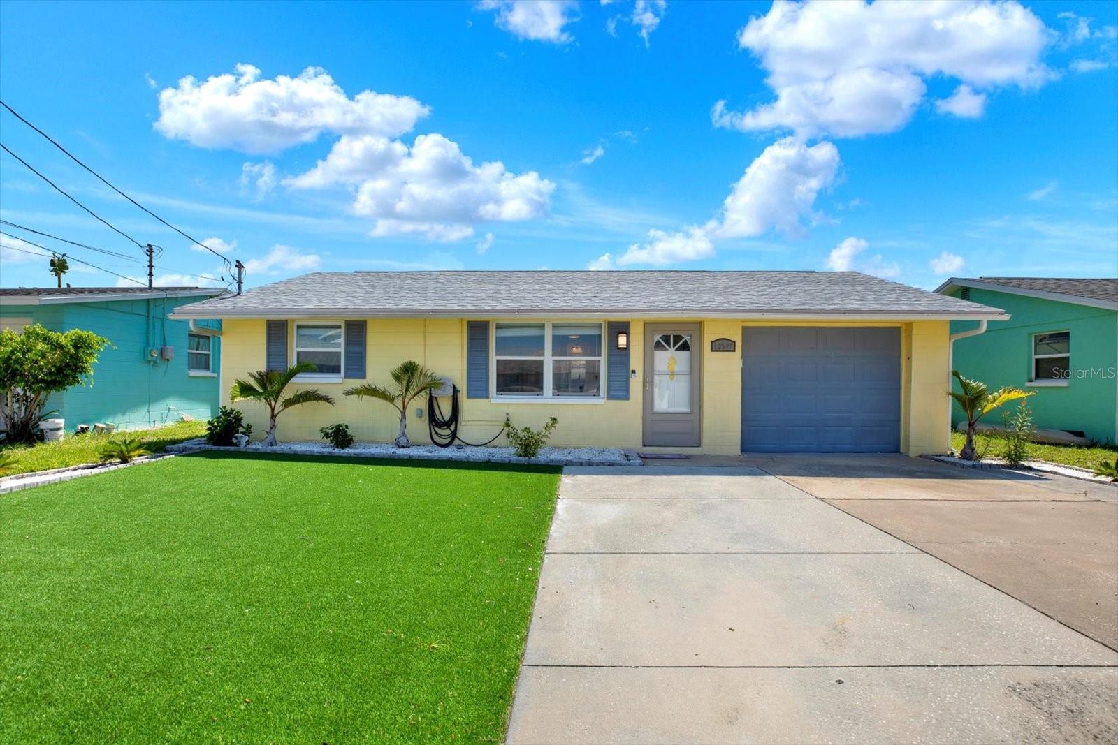 Direct Gulf access, fully furnished, and completely turn-key, this waterfront home is truly move-in ready. Located on a canal just three minutes from open Gulf waters—with no bridges and only one canal to navigate—the property is ideal for boating enthusiasts. Situated on a quiet dead-end street with no through traffic, it offers exceptional privacy and a tranquil coastal atmosphere. Roof 2024, AC 2015. Recent 2025 improvements include a refreshed kitchen, and an updated bathroom, making this a seamless, ready-for-occupancy opportunity. A bonus Florida room with air conditioning and a TV provides additional functional living space, while the low-maintenance turf front yard boosts curb appeal with minimal upkeep. Inside, the home features quartz countertops, shaker-style soft-close cabinetry, stainless steel appliances, wood-look luxury vinyl plank flooring, and a modern tiled shower. A washer and dryer are also included for added convenience. Electrical upgrades completed in 2024 include a new 100-amp panel with exterior disconnect, surge protection, and proper grounding. Outdoor living is a standout, offering a floating dock with two davits, a covered patio, and a fully fenced backyard—perfect for entertaining, relaxing, or accommodating pets. The prime location provides quick access to Hudson Beach, marinas, waterfront restaurants and bars, boutique hotels, grocery stores, and HCA Florida Bayonet Point Hospital. Ideal as a primary residence, second home, or income-producing short-term rental, this low-maintenance waterfront property captures the best of Florida living with outstanding Gulf access.