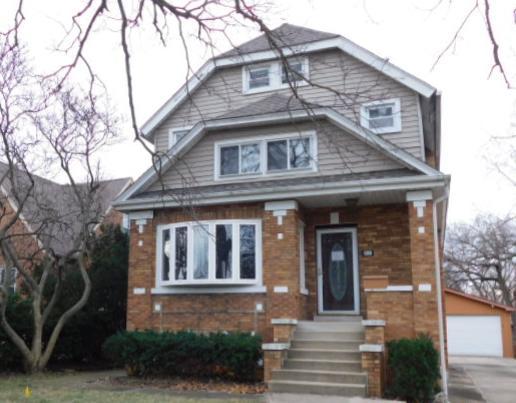 This brick home has three levels of living space, with living and dining room combo, hardwood floors through-out. The kitchen has granite countertops. Enclosed back porch has ceramic tiled flooring. Home has  total of four bdrms , one on the first flr. and full bath, three on the second flr. with two full baths, plus a finished attic. The basement is fullly finished. Two additional bonus rooms in basement.  Two car garage with side drive. Two new a/c condensors, and water service.