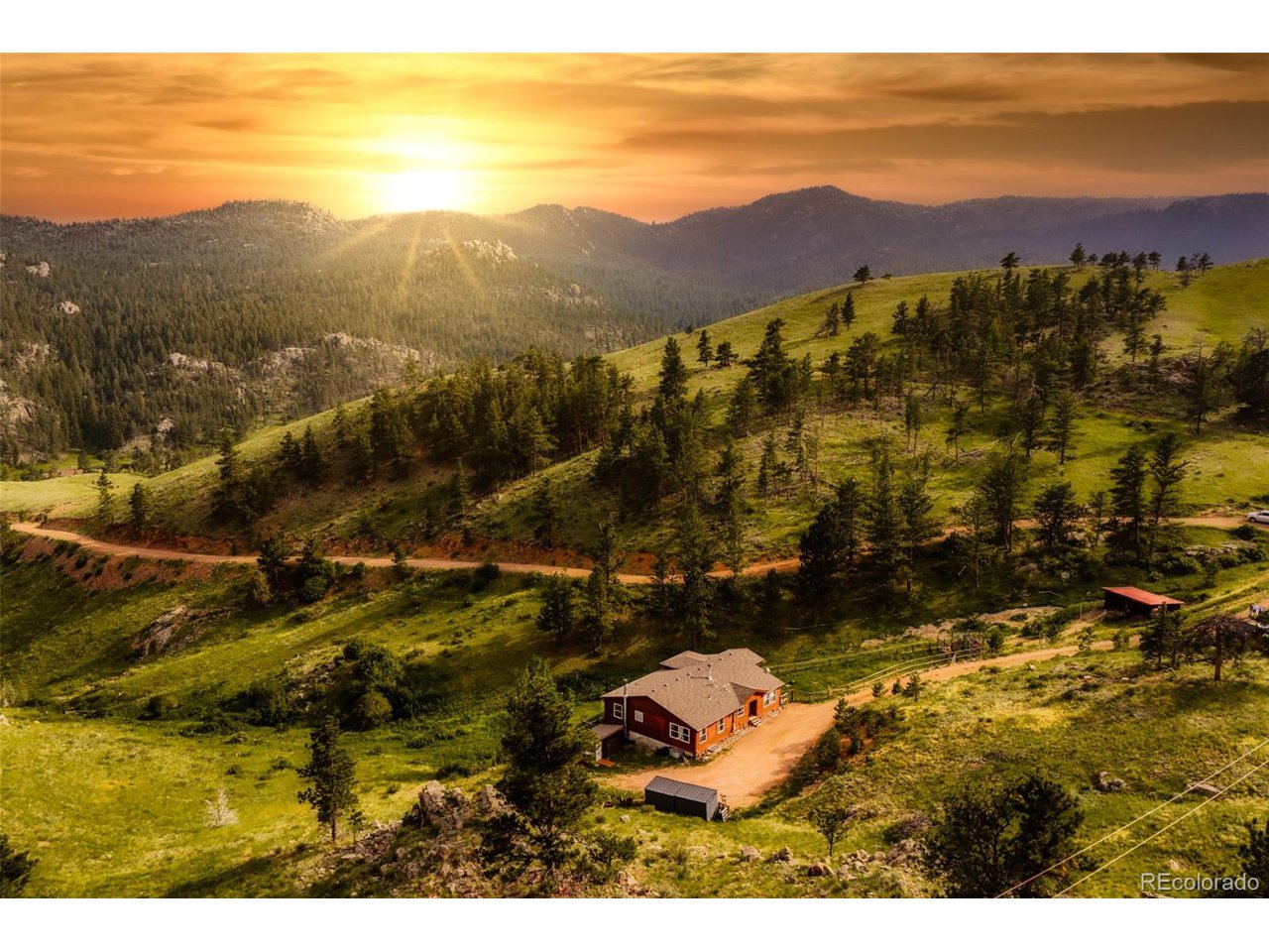 A rare opportunity to own a home on 36.15 acres in the Livermore w/ direct access to the Arapaho/Roosevelt Ntl Forests. Perched atop a pine-covered canyon with sweeping views of Elkhorn Creek Valley, this 5 bedroom home offers a true mountain retreat. Ideal for outdoor enthusiasts, the property provides direct access to hiking, off-roading and big game hunting. Set on the northern portion of the property, the 2-story, wood-sided 5-bedroom modular home offers sweeping views in every direction. The main level features south-facing windows that fill the kitchen, living, and dining areas with natural light, along with 3 bedrooms. The lower level has a spacious walk-out family room, 2 bedrooms, and a private study-perfect for working from home. Each level is equipped with a wood-burning stove, complementing the gas forced-air furnace for efficient year-round comfort. Adjacent, a loafing shed and fenced area provide secure shelter and grazing for horses or other livestock. A nearby chicken coop offers added convenience for hobby farming. The water source is a domestic/stock well and 1,800 gal in-ground cistern. From Elkhorn Creek below, the road climbs nearly 300 feet to an elevation of 7,520 feet, offering panoramic views. Pine trees dot the mountainside, a fenced pasture below the home provides natural grazing for horses, dramatic rock outcroppings frame the valley, creating shelter and scenic perches for local wildlife. Elkhorn Creek on the southern edge of the property, naturally draws big game. There are two parcels (35 acres and 1.15 acres) and no covenants.  Photos of select rooms are virtually staged. Will transfer Starlink in-place.  Seller has a VA loan at an attractive interest rate (2.25%) that may be assumable by a qualified VA-eligible buyer, subject to lender and VA approval. The assuming veteran must use their own VA entitlement points for the loan assumption. Flooring has been removed from basement. Seller to provide credit for new. See before/after pics.