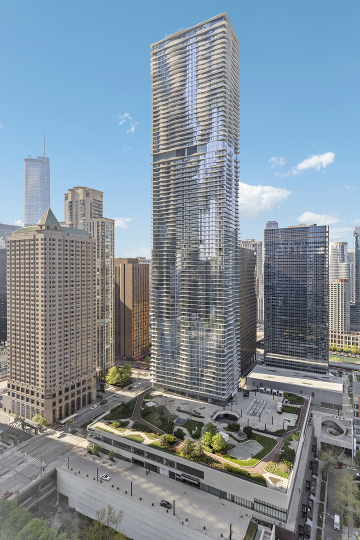 Sitting 62 floors above the city in Aqua, this oversized one-bedroom plus den offers panoramic north, east, and west views with a massive 37-by-7-foot private balcony.    The layout includes 1,210 square feet of well-designed space with floor-to-ceiling windows, walnut hardwood floors, solid-core wood doors, and updated lighting throughout. The den works well as a home office or guest space.    The kitchen features 42-inch Snaidero Italian cabinetry and stainless appliances. The primary suite includes a walk-in closet with custom built-ins, and the bathroom has been extensively updated.    Additional highlights include in-unit laundry and a large storage closet.    Aqua offers full-service living with indoor and outdoor pools, hot tubs, a fitness center, Pilates studio, theater, herb garden, business center, and 24-hour door staff. Monthly assessments include nearly all utilities and services. Parking is available for rent.    Located in Lakeshore East near the Riverwalk, Millennium Park, and the lakefront. Easy access to dining, transit, and downtown offices. A rare opportunity to live this high in the sky.