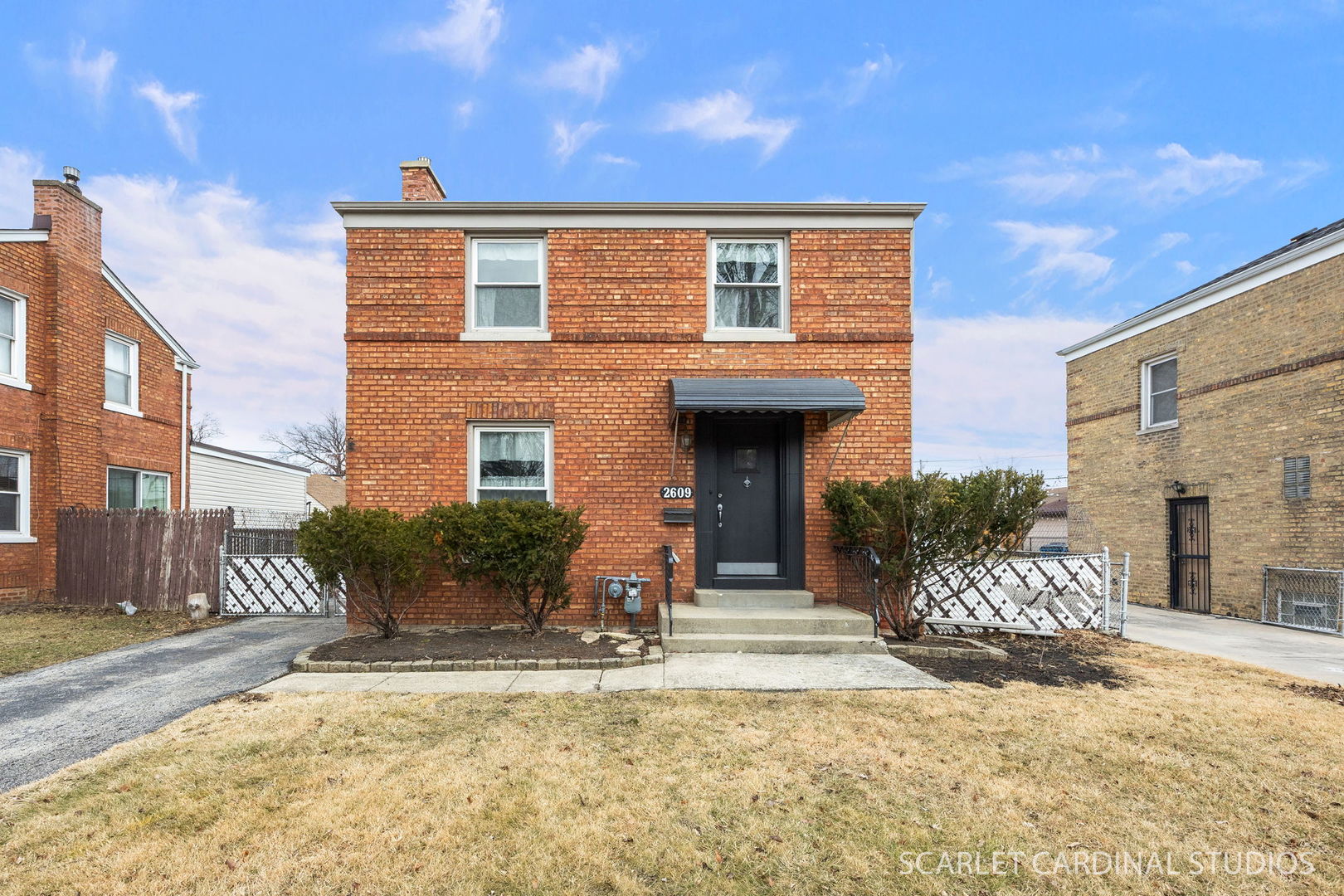 Don't miss this charming and elegant brick Georgian! Beautiful updated kitchen with new cabinets, counters, stainless appliances, can lighting, fixtures and trendy plank flooring. New bath features lovely tiled tub and shower, pretty vanity, matte black fixtures and  ceramic flooring. Two roomy bedrooms upstairs and a finished basement with a comfy family room offering new can lighting and distressed paneling. Also main floor offers a completely updated all-season sun room with distressed paneling, ship lap ceiling, can lighting, plank flooring and sliding glass doors to the back yard. Hardwood floors through most of home. Two and half car garage. Roof 2025 - New AC.  Just painted and pretty as a picture!