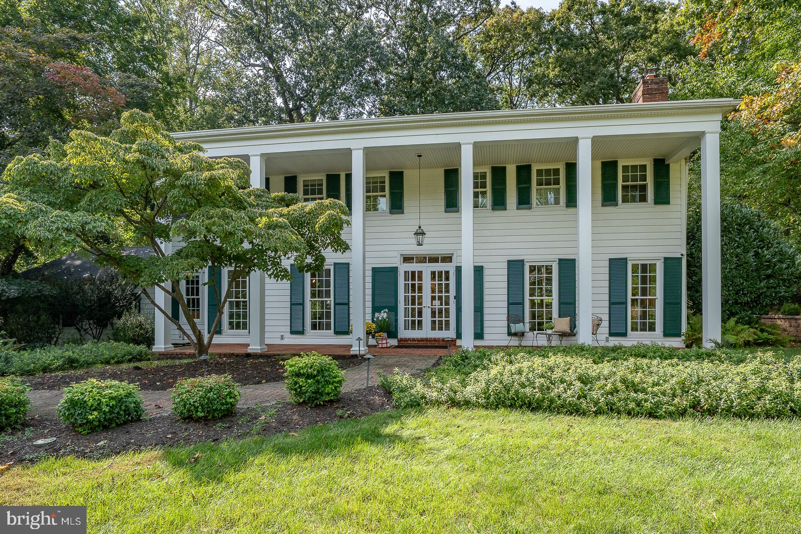 Meticulously maintained and updated 2-story Georgian-style Colonial on a quiet cul-de-sac in the highly sought-after T/E panhandle. Enjoy ultimate convenience close to Wayne and King of Prussia, located within the nationally acclaimed, top-ranked Tredyffrin-Easttown School District. Nestled on a beautifully landscaped, wooded lot, this captivating home features stunning hardwood floors and a classic layout with wonderful design surprises.                        The main level boasts an elegant center-hall layout with a gracious, step-down living room with a fireplace and formal dining room. A private study/home office offers a dedicated workspace. The cozy family room features a classic den atmosphere and opens seamlessly into the renovated kitchen, which has been expanded to include a breakfast area, pantry room, mudroom, and separate laundry. A rare main-level 4th bedroom suite features ample closet space and a private en-suite full bath—perfect for in-laws, guests, or a 1st-floor master.                        Upstairs, the expansive primary retreat features an enlarged, spa-like bath with an oversized shower and built-in storage, plus a spectacular custom dream closet expanded into a former bedroom. Two additional large bedrooms each access renovated full bathrooms, including one en-suite with a walk-in closet and one utilizing a gorgeous hall bath with a tub. Endless storage is available in the walk-up attic, which could be expanded for an additional bedroom, work, or play space.                        The professionally waterproofed lower level offers additional high-quality finished living space with exquisite trim, a built-in entertainment area with surround sound, a homework/craft station, and extra storage.                         Outside, the property features gorgeous specimen trees providing four-season interest, a welcoming front porch, an expansive rear patio accessed from the family and breakfast rooms, and a lush grassy yard—perfect for outdoor entertaining. There is a whole-house generator and 4-zone heating, and2-car attached garage.  Excellent condition, lovely details.  This one is special - not to be missed!