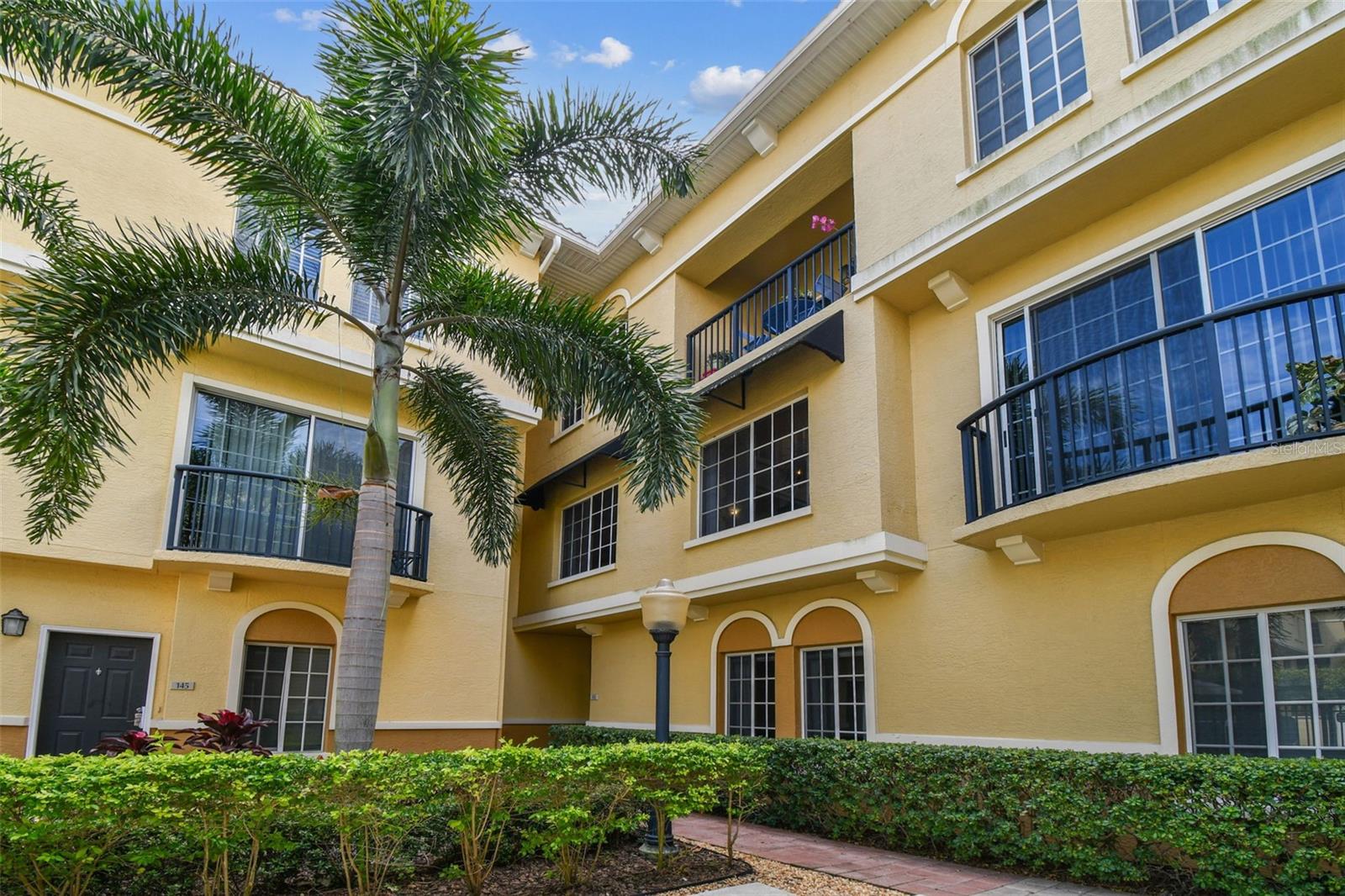 What a wonderful opportunity to own a spacious 3-bedroom, 3-bath luxury townhome in the highly sought-after Cordoba Beach Park and ideally located in Tampa’s popular Westshore and Plant High Schools District. This move-in ready residence combines timeless design, resort-style amenities, and an unbeatable location just minutes from everything in the Tampa Bay Area.

Welcome to Cordoba Beach Park, a beautifully maintained luxury community featuring a lavishly appointed clubhouse, a resort-style pool, a 24-hour fitness center with state-of-the-art cardio and strength equipment, and a business center. The HOA includes water, sewer, insurance, valet trash service, and full grounds and amenities maintenance, providing easy, worry-free living.

This stunning three-story townhome offers both functionality and sophistication.
The ground level features a welcoming front entry, an oversized two-car garage, and a bonus room ideal for a home office, gym, or den.

On the second floor, you’ll find an expansive open-concept living and dining area with vaulted ceilings, crown molding, and premium engineered hardwood flooring throughout. The chef-inspired kitchen boasts granite countertops, stainless steel appliances, ample cabinetry, and a generous breakfast bar—perfect for entertaining. Also on this level is the third bedroom with a full bathroom, offering flexibility for guests or multi-generational living.

The third floor showcases the luxurious primary suite, complete with a private ensuite bath, a walk-in closet, and elegant French doors opening to a serene balcony with tropical views of the lushly landscaped grounds and resort pool. The second ensuite bedroom on this floor features another spacious closet and an abundance of natural light.

This home is elevated and has never experienced flooding, offering valuable peace of mind in South Tampa. With fresh paint and stylish finishes, it’s truly move-in ready and designed for modern comfort.

Perfectly situated, Cordoba Beach Park places you minutes from Tampa International Airport, Downtown Tampa, Midtown, Westshore Plaza, International Plaza, and an array of fine dining and shopping options. Major highways, including I-275 and the Veterans Expressway, are just around the corner, providing easy access to St. Petersburg, Clearwater, and some of the most beautiful beaches in the country.

Experience the best of Tampa living in one of South Tampa’s most desirable luxury communities. This remarkable residence blends style, comfort, and convenience in an unbeatable location. Come see why Cordoba Beach Park is one of Tampa’s premier addresses—this home is truly a must-see!