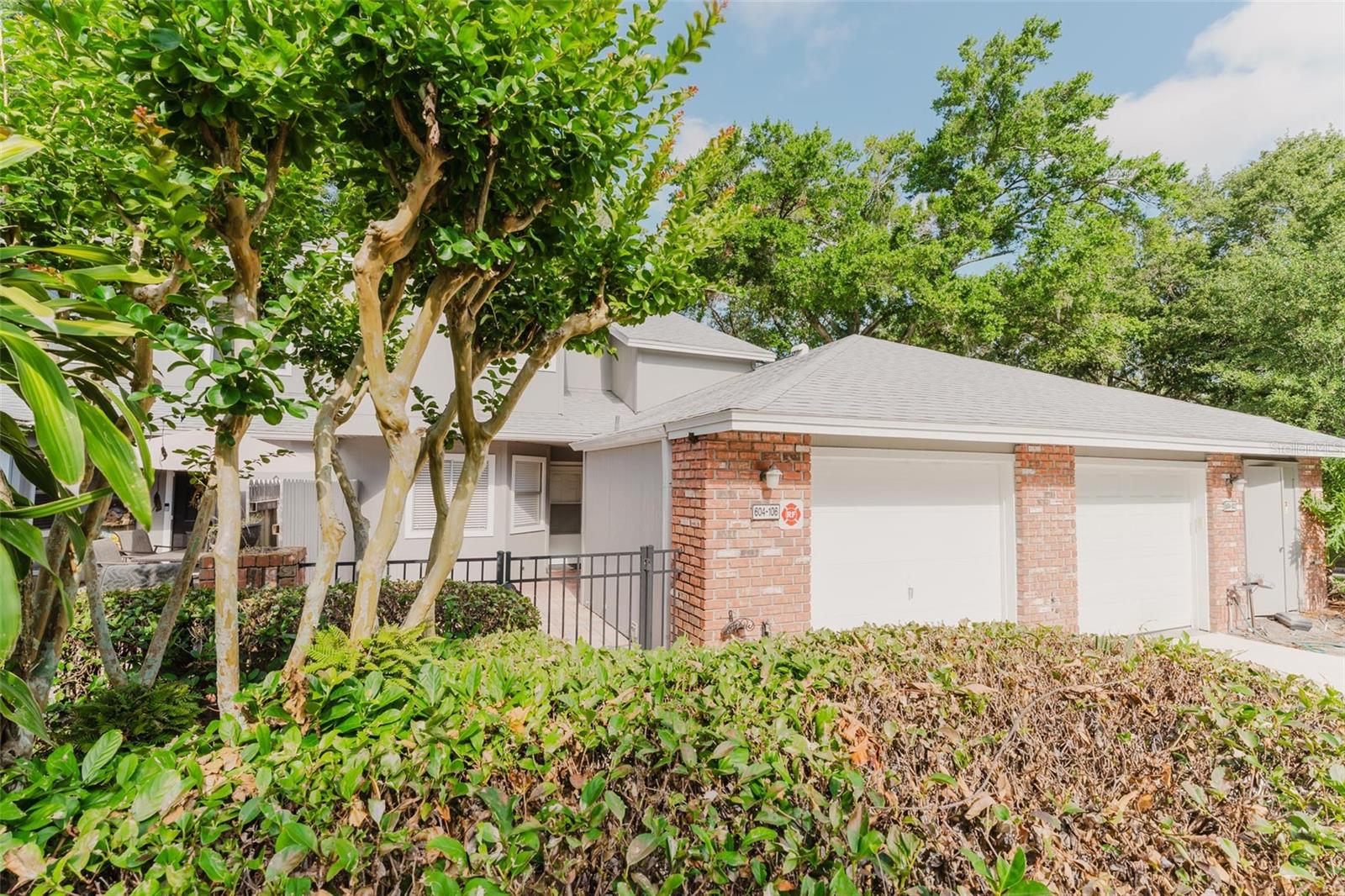 Step inside 604 Chestnut Oak Cir #106 in Altamonte Springs, Florida, and discover a place that feels like home from the moment you arrive. This 3-bedroom, 2.5-bath townhome in the sought-after gated community of Oak Harbour blends comfort, style, and thoughtful updates—all move-in ready.

Out front, a private pavered courtyard welcomes you with charm. Inside, soaring ceilings and abundant natural light create an open, airy vibe. The primary suite is conveniently located on the main floor, offering privacy and ease of access—a rare find in townhome living.

The kitchen is designed for both function and flair, featuring granite countertops, stainless steel appliances, and a pass-through window that connects to the main living space—perfect for casual entertaining or family dinners. Throughout the home, you’ll find wood-look tile floors in the main areas and newer carpet in the bedrooms for added comfort.

This home has been smartly updated for peace of mind and energy efficiency. Both A/C units were replaced in 2023 and 2025, extra insulation was added to the attic, and there's a new garbage disposal. The roof, skylights, gutters, and exterior paint were all refreshed in 2022—taking major maintenance off your plate.

Step out back to a screened-in patio that offers a peaceful space to unwind. And here’s a huge bonus—Spectrum internet and cable are included in the HOA, saving you money and hassle.

At Oak Harbour, it’s not just a home—it’s a lifestyle. Enjoy resort-style amenities including a sparkling pool, tennis courts, fitness center, shuffleboard, clubhouse, scenic lake views, a fishing dock, and limited boat parking for weekend getaways.

Located near I-4, Altamonte Mall, Cranes Roost Park, and local shopping and dining, this townhome offers unbeatable convenience in a peaceful, well-maintained community.

If you’ve been searching for a move-in-ready townhome in Altamonte Springs, 604 Chestnut Oak Cir #106 delivers on every level—location, lifestyle, and lasting value.