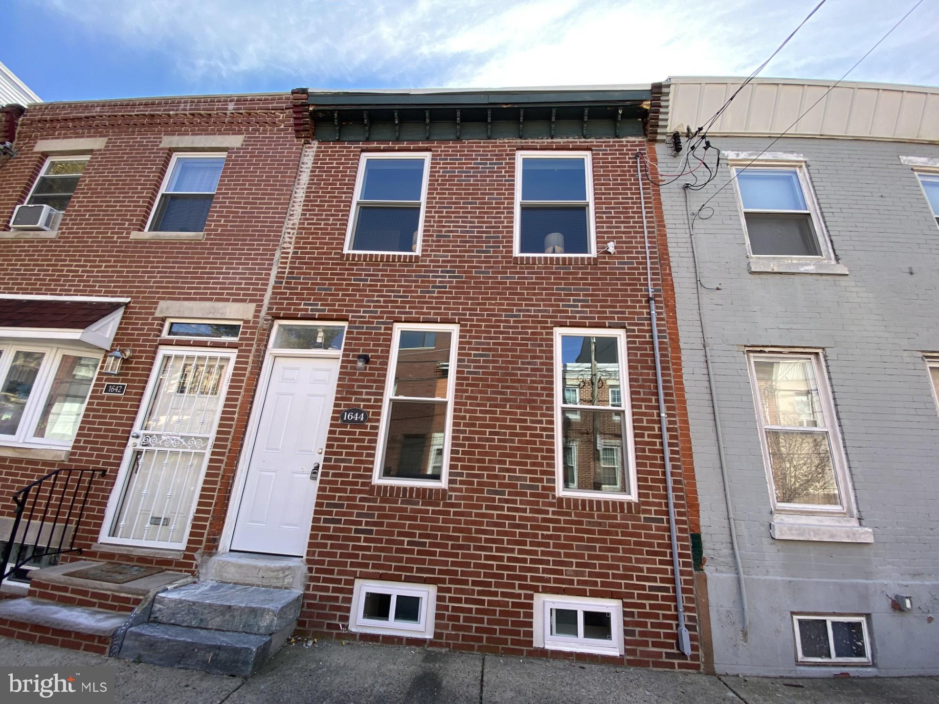 Nestled in the charming enclave of Point Breeze, this exquisite interior row townhouse seamlessly blends historic elegance with modern comforts. As you step inside, you are greeted by a thoughtfully designed layout that maximizes space and light. The main living area exudes a sense of comfort, featuring classic architectural details that pay homage to its storied past. Large windows allow natural light to flood the space, creating a bright and airy atmosphere. The open-concept design flows effortlessly into the dining area, making it ideal for both casual meals and elegant dinner parties. The kitchen offers ample storage and prep space and opens directly to a large private patio and outdoor space, a retreat for grilling, gardening, entertaining, or relaxing. Upstairs, you’ll find a full bath and two nicely sized bedrooms featuring luxury plank floors, generous closet space, and excellent natural light. The finished lower level provides flexible space for a home office, gym, playroom, or storage, with a full bath and laundry area. Point Breeze is known for its friendly atmosphere and proximity to local parks, cafes, and boutique shops, making it a perfect place to unwind and connect with neighbors. Parking is hassle-free with on-street options readily available, ensuring that you can easily come and go as you please. Embrace the opportunity to make this enchanting property your own and create lasting memories in a space that truly feels like home.