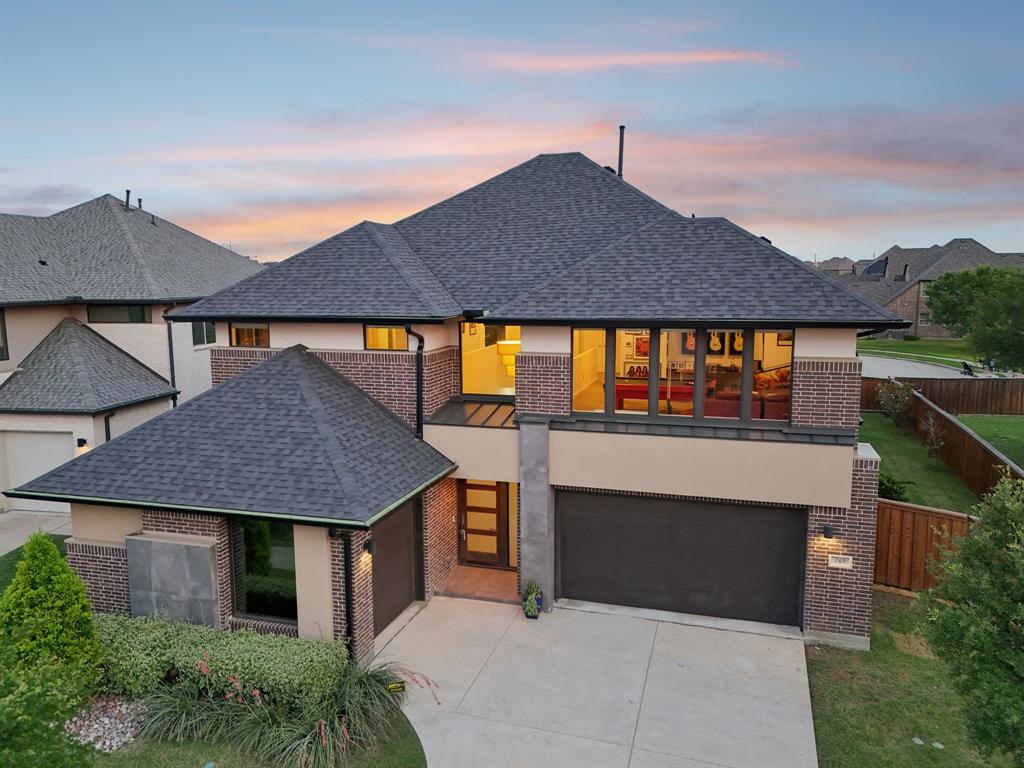 Discover contemporary elegance in this stunning north facing Main Vue home located in the highly sought-after Phillips Creek Ranch in Frisco. Situated on a premium lot backing to a quiet cul-de-sac with no neighbors behind it, this 5-bedroom, 7 bathroom residence offers 4,267 sqft of sophisticated living space with 3-car garage. Its distinct design is clean, modern, and airy and the home includes a private study for remote work, and SMART HOME Control4 integration for modern convenience. The open-concept floor plan draws in natural light showcasing the expansive windows and designer lighting. Enhanced with premium finishes it embodies an atmosphere perfect for relaxing and entertaining. At the heart of the home is a chef’s dream kitchen with sleek frameless cabinetry, a large quartz island, stainless steel appliances including double ovens, and a versatile bar area ideal for a coffee bar or butler’s pantry. The main floor offers both a luxurious primary suite with a spa-inspired bathroom with an oversized soaking bath plus an extra-large walk-in shower and additionally, there is a guest bedroom on the main level. Upstairs, you'll find three more spacious bedrooms, a large game room, and a dedicated media room—perfect for movie nights and gatherings. Step outside to your own backyard oasis complete with a sparkling contemporary pool and a built-in fireplace—ideal for enjoying peaceful Texas sunsets in the cooler months. Zoned for exemplary Frisco ISD schools, this home offers access to two playgrounds, a community pool, and a clubhouse, with scenic trails. Its prime location places you just minutes from The Star, upscale shopping, dining, and major highways—blending serenity with everyday accessibility. This one-of-a-kind property is a rare opportunity to own a luxurious, modern home in one of Frisco’s most desirable communities. Don’t miss it! (new roof 2024!).