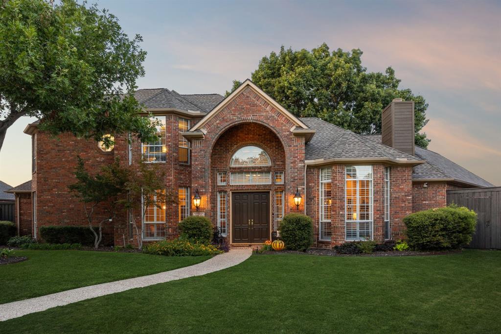 Nestled on an expansive cul-de-sac lot in the prestigious Carriage Hill community, this exquisite two-story brick estate blends timeless sophistication with modern comfort. A grand foyer with soaring ceilings sets the stage, flanked by a formal dining room designed for sophisticated gatherings and a formal living room highlighted by a dramatic floor-to-ceiling fireplace and magnificent plantation-shuttered windows. The Chef's kitchen is a true showstopper with its granite countertops, large island, white custom cabinetry, stainless steel appliances, raised breakfast bar, and a sunlit breakfast nook framed by a wall of windows. Off the kitchen, the inviting family room provides a second living space, complete with a stunning brick fireplace, backyard views, and convenient access to the wet bar—perfect for seamless entertaining. The luxurious first-floor primary suite boasts tiered ceilings and a spa-inspired bath featuring dual vanities, a freestanding soaking tub, and a separate walk-in shower. A private guest suite completes the main level, while the upstairs retreat offers a versatile game room or study along with two additional bedrooms. Outdoors, enjoy a covered patio overlooking the expansive backyard—ideal for creating your dream pool, garden, or outdoor living oasis.