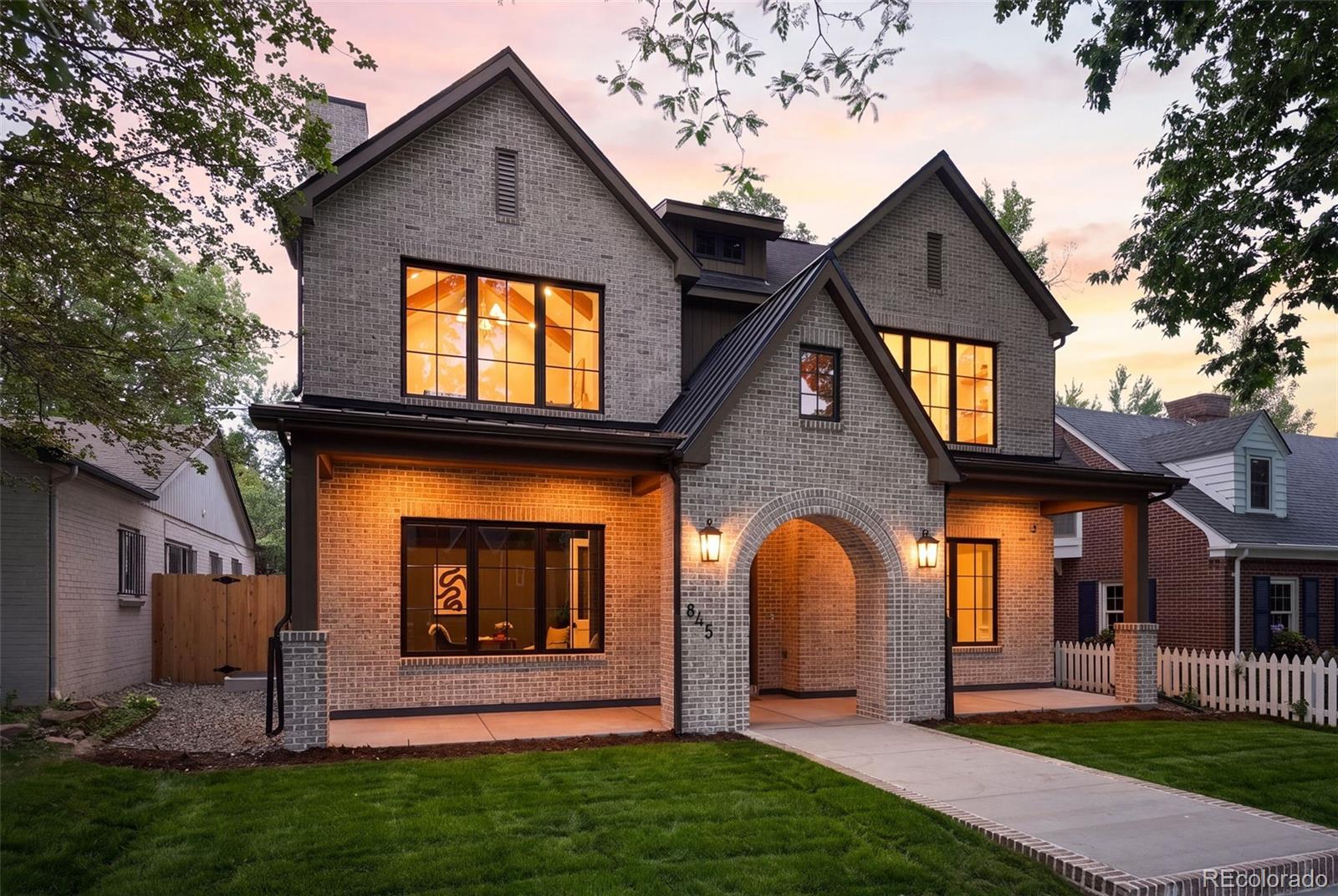 Perfectly positioned on a quiet, tree-lined street just half a block from Bonnie Brae Park, this 5,000-square-foot custom residence combines an exceptional location with timeless craftsmanship—a rare opportunity in Southeast Denver. From the moment you step inside, the attention to detail is evident, with custom white oak cabinetry, 9-inch-wide plank white oak flooring, poplar trim and doors, coffered ceilings, a fully welded steel railing, and quartzite countertops throughout.Just off the foyer, the private office offers a remote-controlled fireplace and oversized casement windows that flood the space with natural light. Across the hall, the formal dining room is enhanced by coffered ceilings, concealed rope lighting within the crown molding, and seamless access to the butler's pantry and chef's kitchen. Designed for everyday living and effortless entertaining, the kitchen showcases custom white oak cabinetry, panel-ready Dacor appliances, a custom range hood, a full-height marble backsplash, a quartzite sink, and an oversized quartzite island.At the rear of the home, a dramatic 16-foot sliding glass door opens to a 400-square-foot outdoor living area complete with a paver patio, timber pergola, and gas connection for an outdoor grill, creating a seamless extension of the home's living space.The expansive lower level continues the home's warm, refined aesthetic with 9-inch-wide hardwood flooring, precast window wells with integrated metal ladders, a spacious family room, full wet bar, billiards area, storage room, and a 225-square-foot fitness room. Designed for entertaining and everyday living, it offers the comfort and functionality of a true extension of the main level.Homes of this caliber in Bonnie Brae are few and far between. Experience the quality, craftsmanship, and attention to detail for yourself.