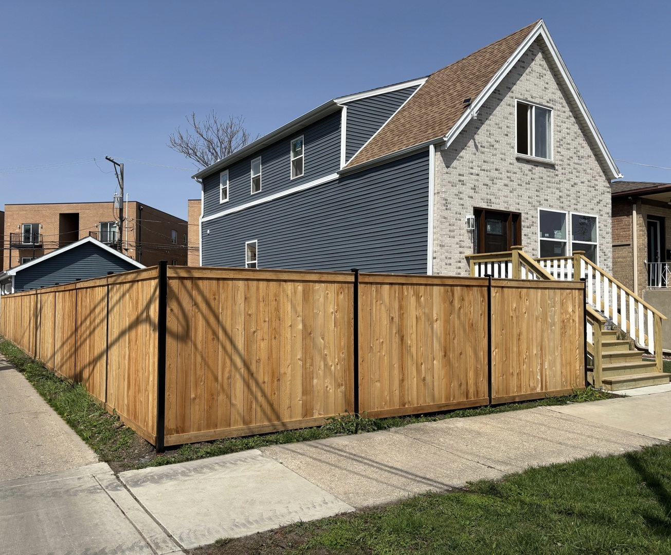 Welcome to this beautifully renovated dream home on a quiet one-way street in the prime Avondale area. Situated on a double, professionally landscaped, Chicago-wide lot, this home features an oversized 3 car garage and new high-end cedar privacy fencing throughout-creating a backyard oasis perfect for entertaining a large crowd. This stunning 4 bedroom, 3.1 bathroom home has been completely rebuilt with all new plumbing, heating, and electrical systems. Notable upgrades include a 1.5-inch new city water pipe, double drywall for all the water pipes, spray foam insulation, and hardwood flooring throughout the first and second floors. The open-concept kitchen is outfitted with white cabinetry, quartz countertops, and stainless steel appliances. The second floor offers three bedrooms and two bathrooms, including a beautiful ensuite in the primary bedroom. The fully finished basement features a large family room, an additional bedroom, and a full bathroom. Conveniently located near shops and restaurants, the Blue Line 'L' stop, buses, and highways. Don't miss this one.