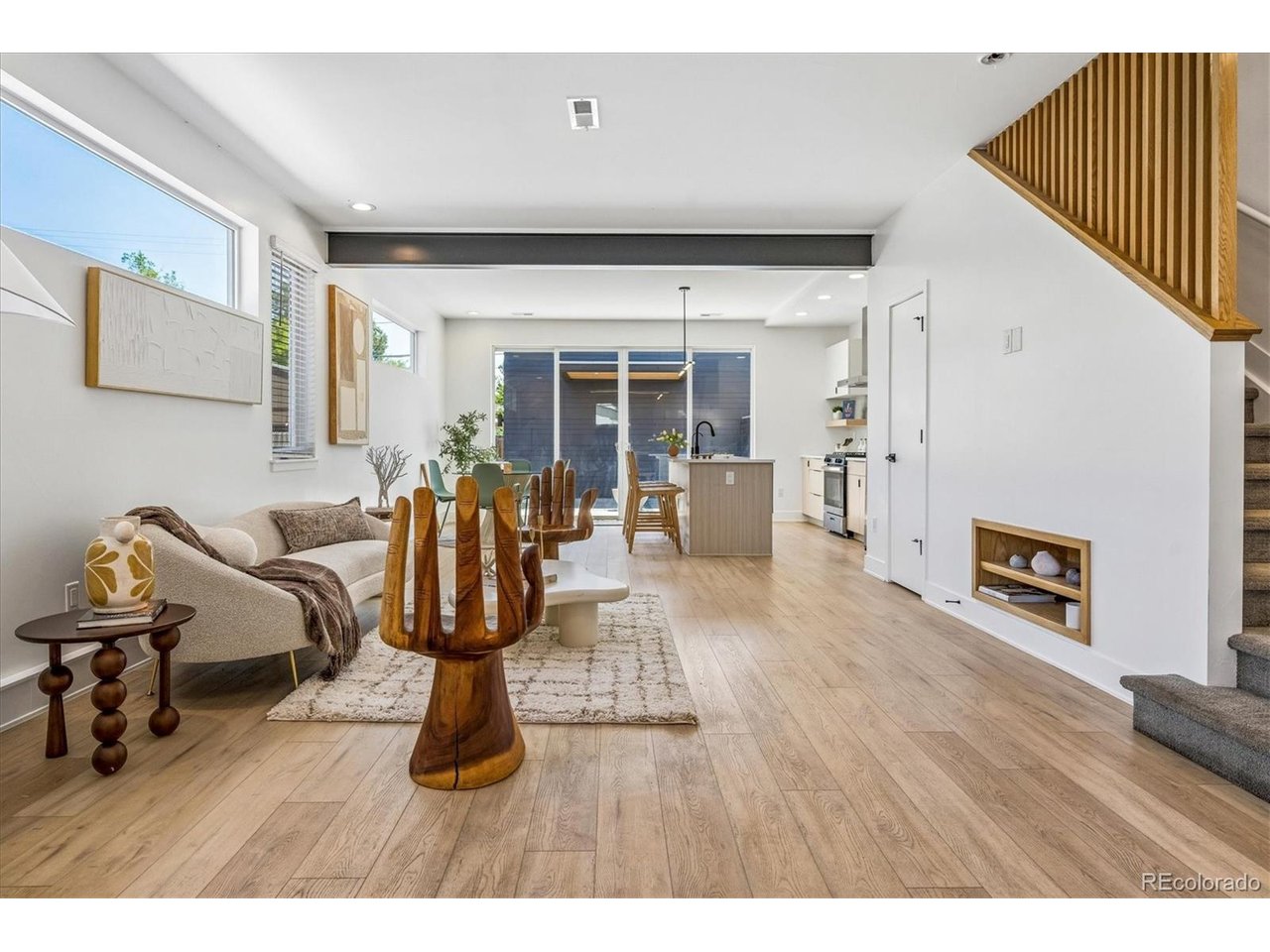 Built in 2022, this striking contemporary residence seamlessly blends modern architecture with thoughtful design in one of Englewood's most convenient locations. The open-concept main level is filled with natural light and showcases exposed steel beams, a custom wood slat feature wall with a built-in media niche, and designer finishes throughout. The gourmet kitchen is the centerpiece of the home, featuring quartz countertops, an oversized island with seating, flat-panel cabinetry, stainless steel appliances, a gas range, floating shelves, and abundant prep space. A dedicated main-level office with French doors provides the perfect work-from-home space, while a convenient powder bath completes the first floor.Upstairs, the spacious primary suite features dual walk-in closets and a luxurious en-suite bath, while two additional bedrooms and a centrally located laundry room provide comfort and convenience for everyday living. Step outside to a private, low-maintenance backyard featuring artificial turf, a modern concrete patio, and a gas fire pit perfect for relaxing or entertaining. The oversized detached garage features exceptionally tall ceilings, providing abundant overhead storage in addition to secure parking.Ideally located with quick access to light rail, downtown Englewood, South Broadway, restaurants, parks, and major commuter routes, this move-in-ready home offers a rare combination of contemporary design, thoughtful functionality, and an unbeatable location. Listing broker is a principal in this transaction and is a licensed real estate broker in the State of Colorado.