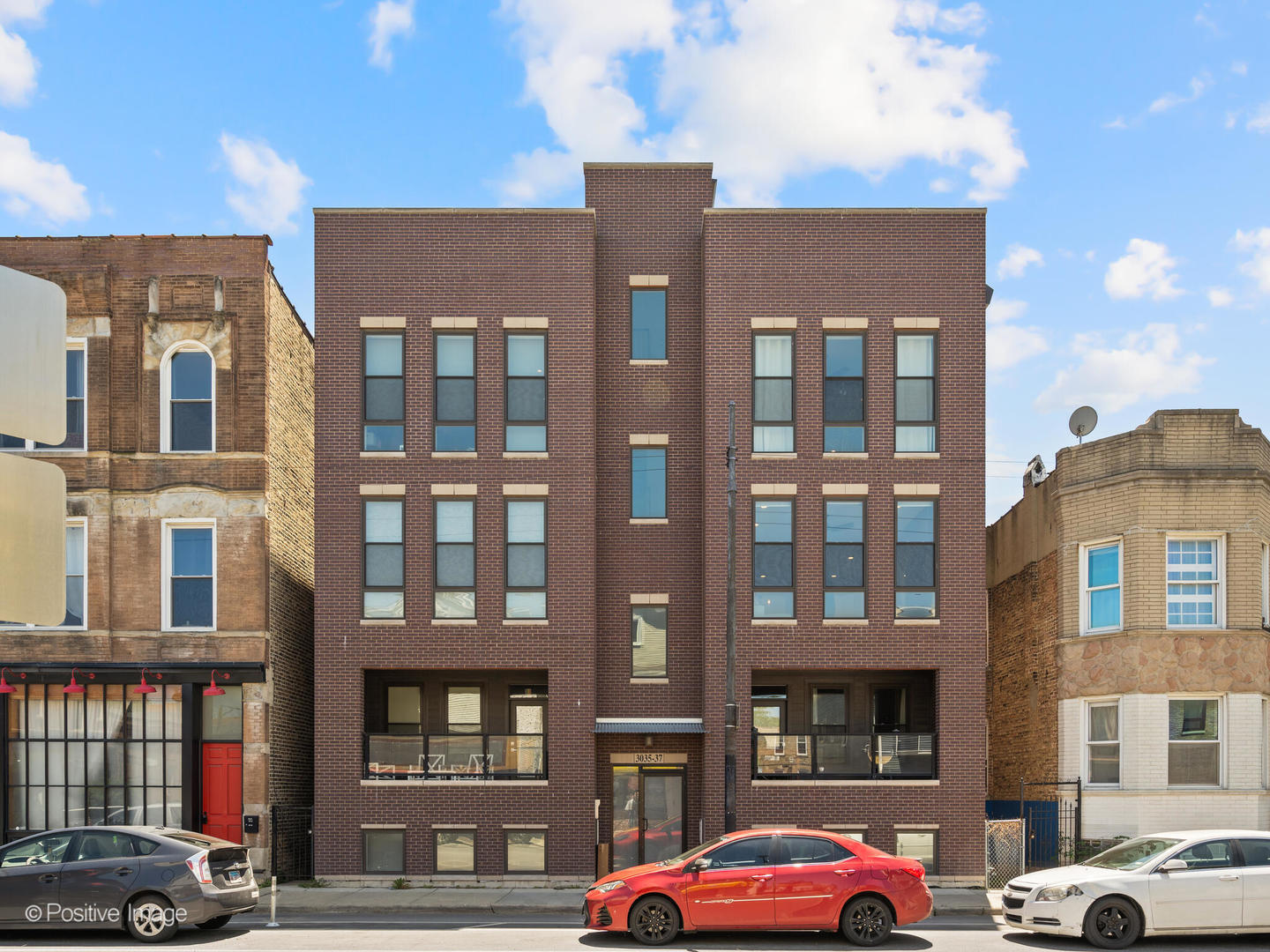 This meticulously maintained 3-bedroom, 2-bathroom condo, built in 2018, is located in a boutique building in the heart of Avondale-one of Chicago's most vibrant and evolving neighborhoods. Designed with both style and function in mind, the home features soaring 10-foot ceilings, hardwood floors throughout, and an open layout that blends elegant finishes with everyday comfort. The chef-inspired kitchen is equipped with 42-inch upper cabinets, granite countertops, deep drawers for ample storage, and a high-end Thermador appliance package, including a vented hood and built-in microwave within an oversized island ideal for casual dining or entertaining. The kitchen opens seamlessly to a bright living area with floor-to-ceiling windows and a sleek glass gas fireplace, creating a warm and inviting atmosphere. Privately situated at the end of the hall, the spacious primary suite offers three custom closets-including a large walk-in-and a spa-like ensuite bathroom with heated floors, a double vanity, and an oversized walk-in shower with frameless glass and multiple spray options. From the primary suite, step directly onto your own private rear deck-perfect for quiet mornings or relaxed evening grilling. Two additional bedrooms down the hall provide flexible space for guests, a nursery, or a dedicated home office, and are conveniently located near a second full bath with modern finishes. The home also boasts a second outdoor terrace and an expansive 20' x 22' private rooftop deck with built-in speakers-ideal for entertaining, enjoying skyline views, or relaxing under the stars. Additional premium features include side-by-side in-unit laundry, a Navien tankless water heater with upgraded condensate neutralizer, built-in speakers throughout the living room, primary suite, and rooftop deck, as well as a smart video intercom with a touchpad for added security and convenience. Secured garage parking is included in the price. Located just steps from acclaimed restaurants, neighborhood cafes, local breweries, parks, and public transportation, this home delivers modern luxury and turnkey living in one of Chicago's most desirable neighborhoods.